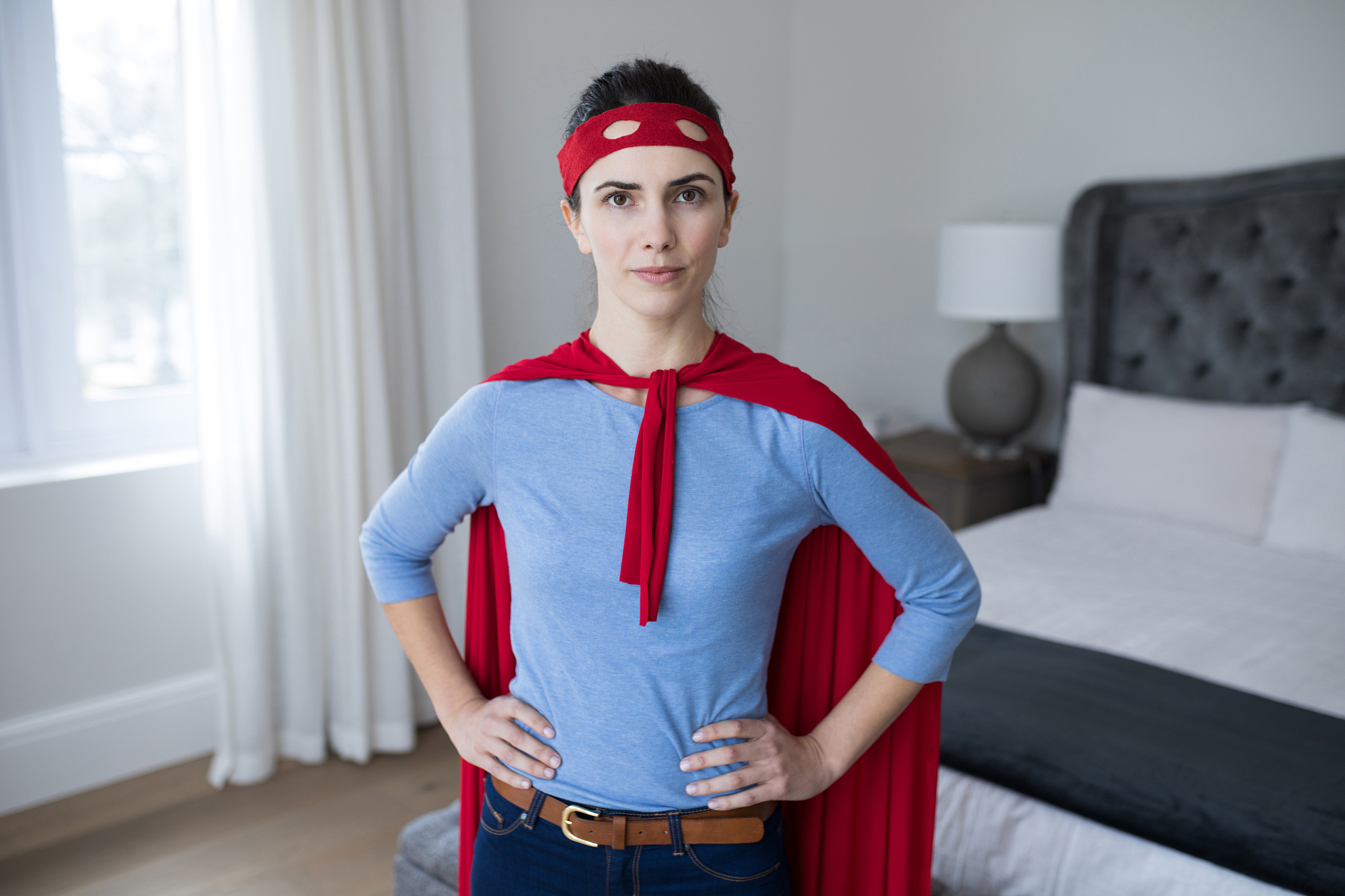 portrait of beautiful woman pretending to be superhero