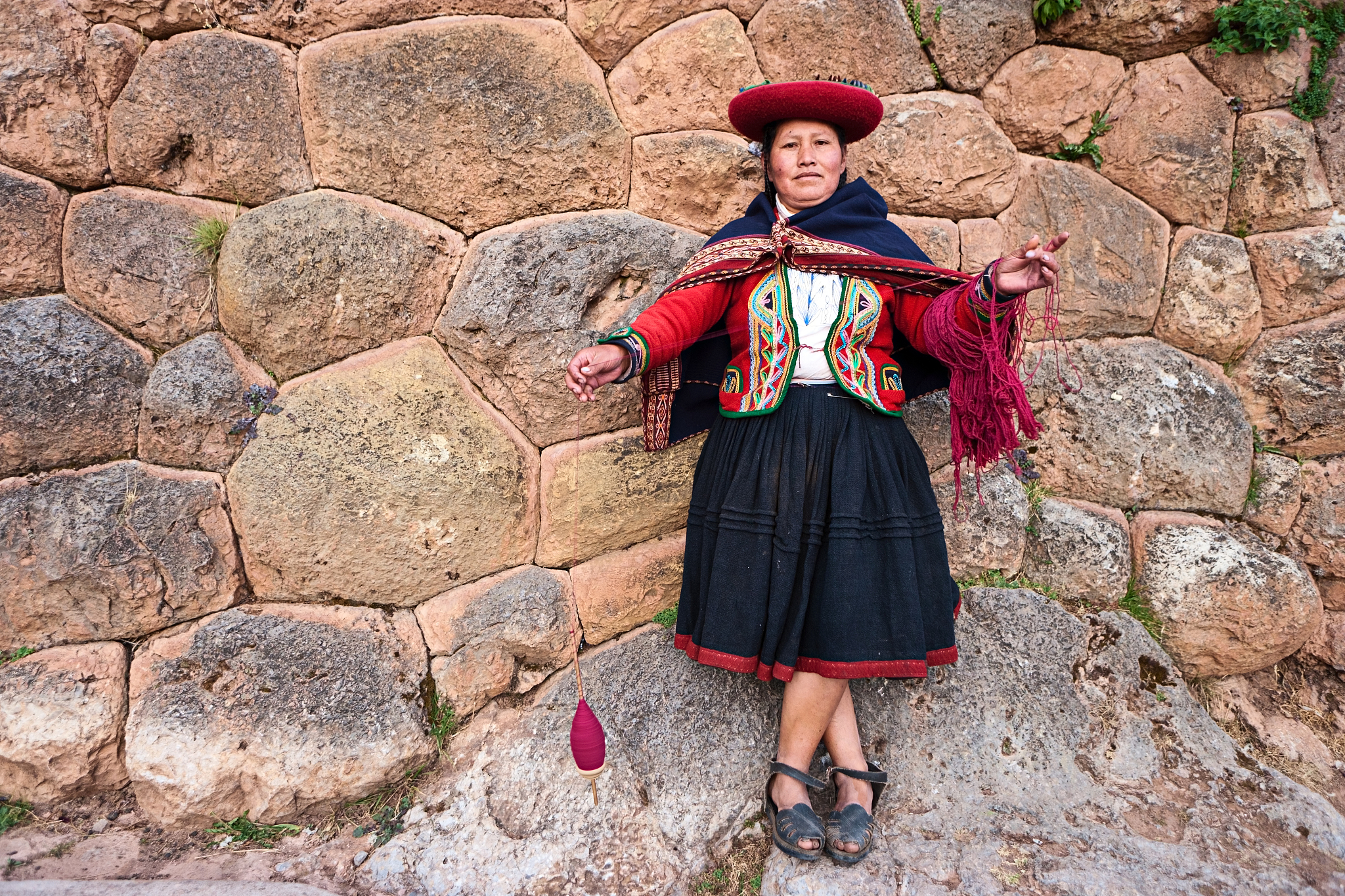 peruvian woman spinning wool, the sacred valley, chinchero