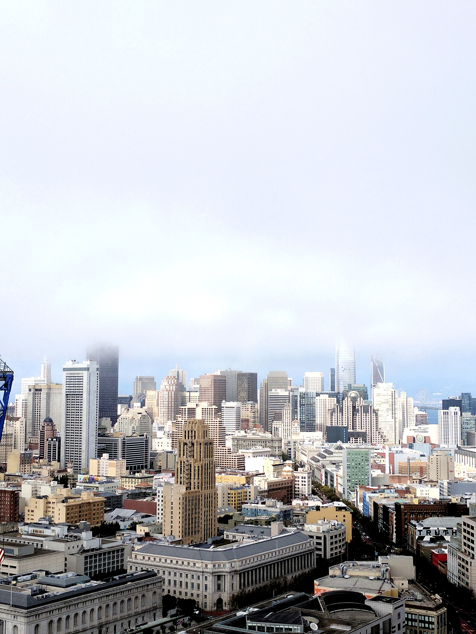 cityscape against foggy sky