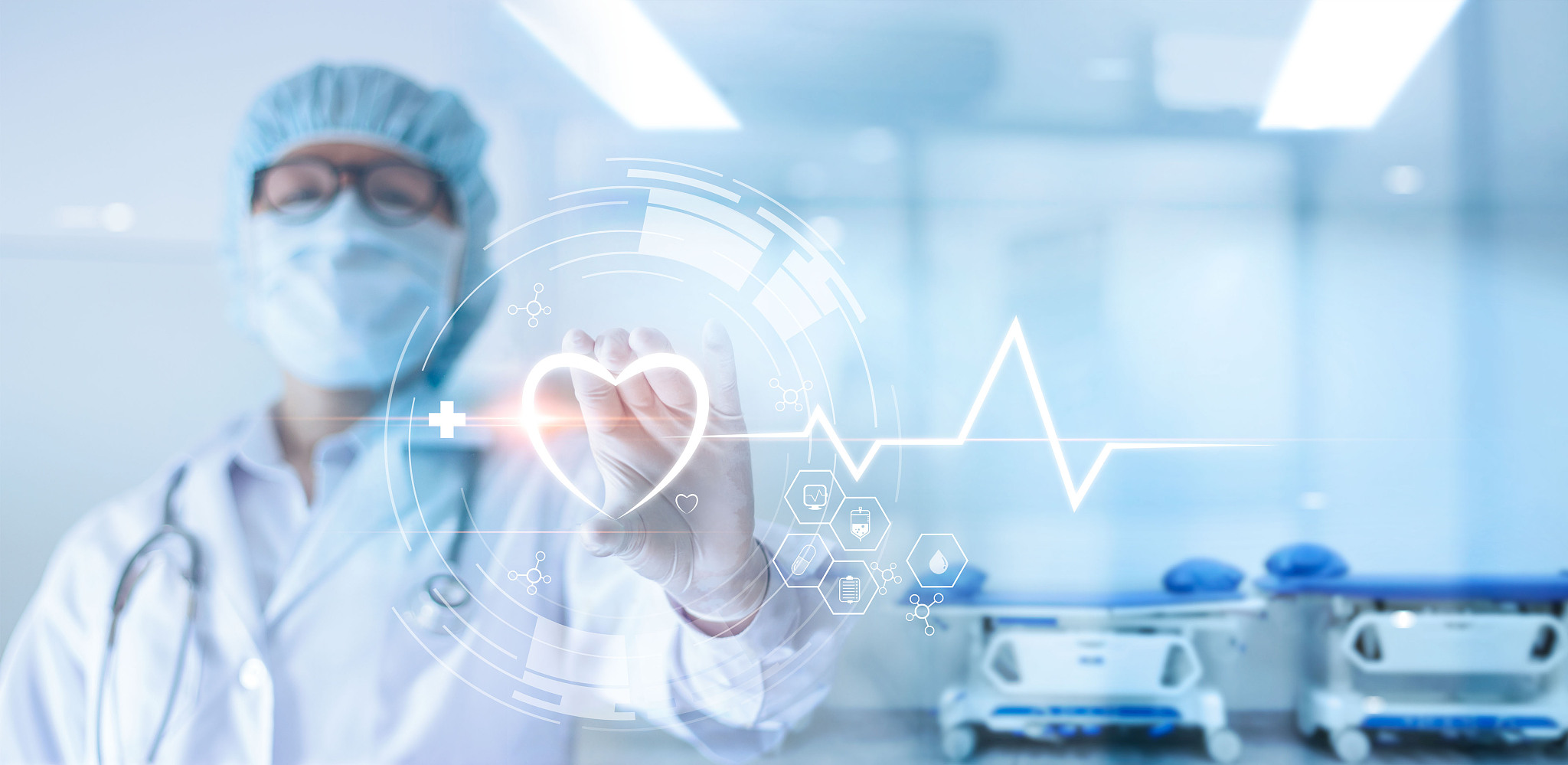 cardiologist doctor with stethoscope holding heart shape in hand