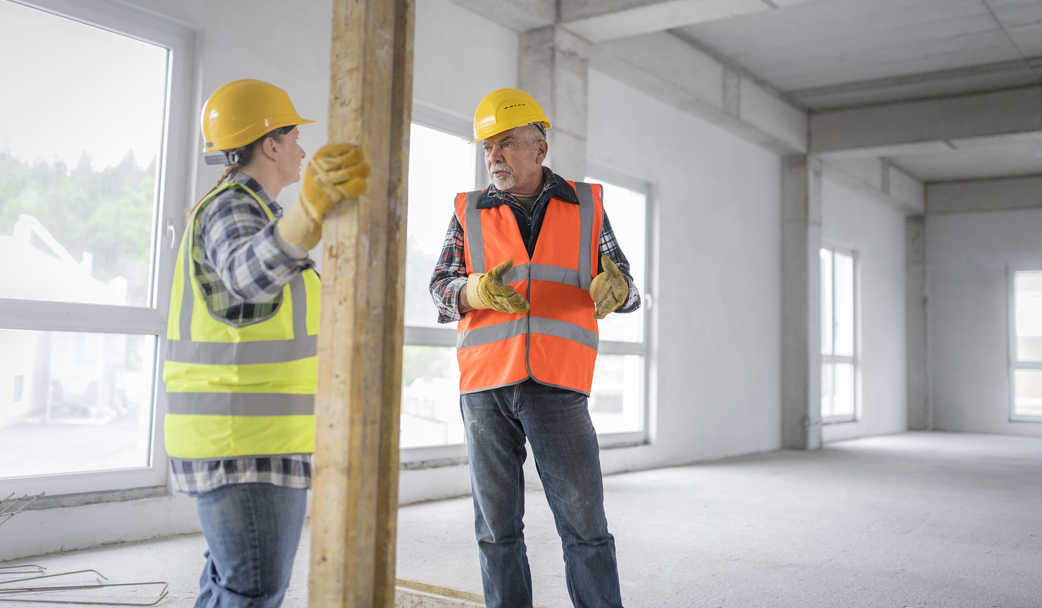 construction workers discussing at site