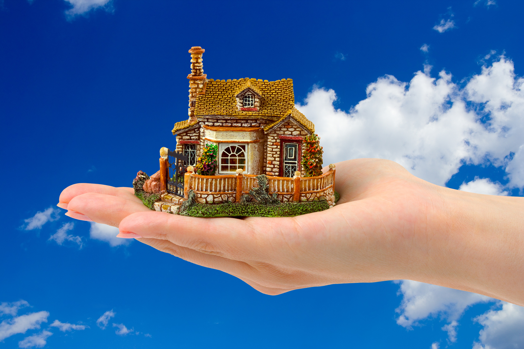 hand and house