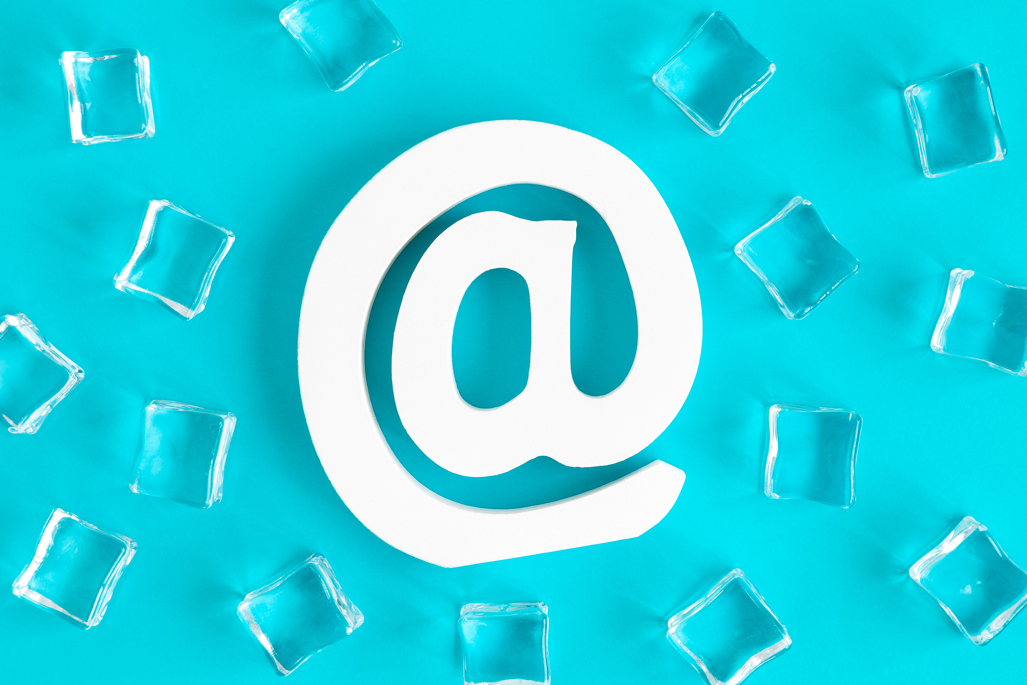 high angle view of email symbol and ice cubes abstract isolated 