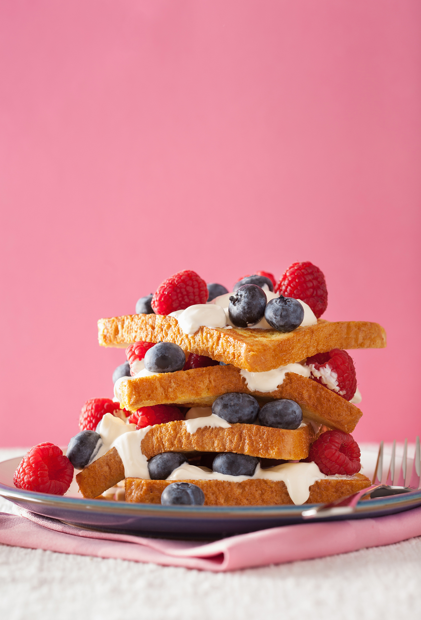 french toasts with creme fraiche and berries for breakfast