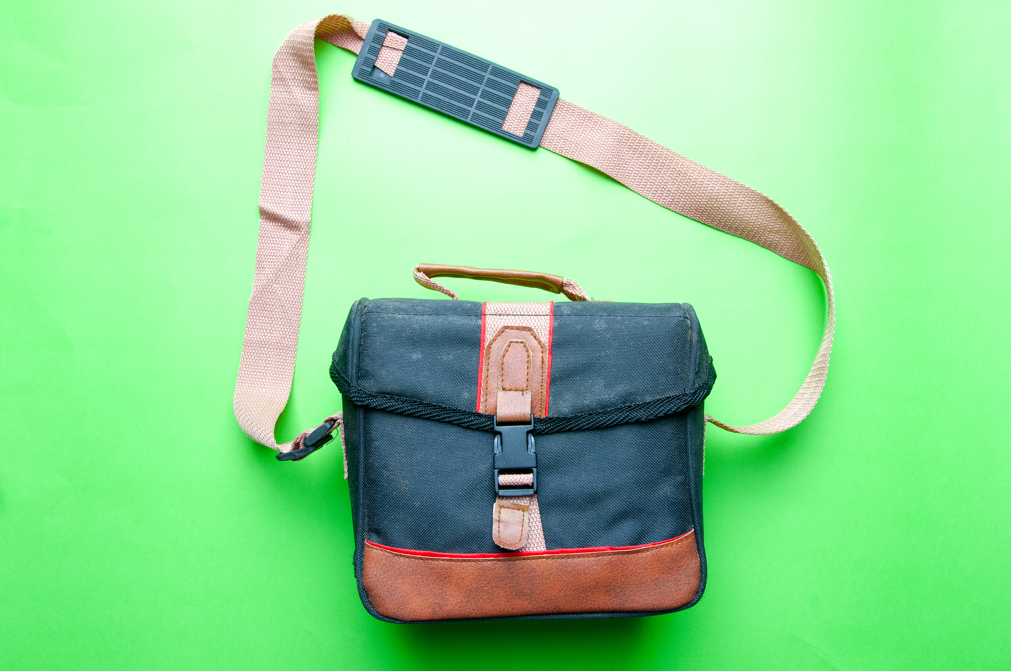 old camera bag on a green background