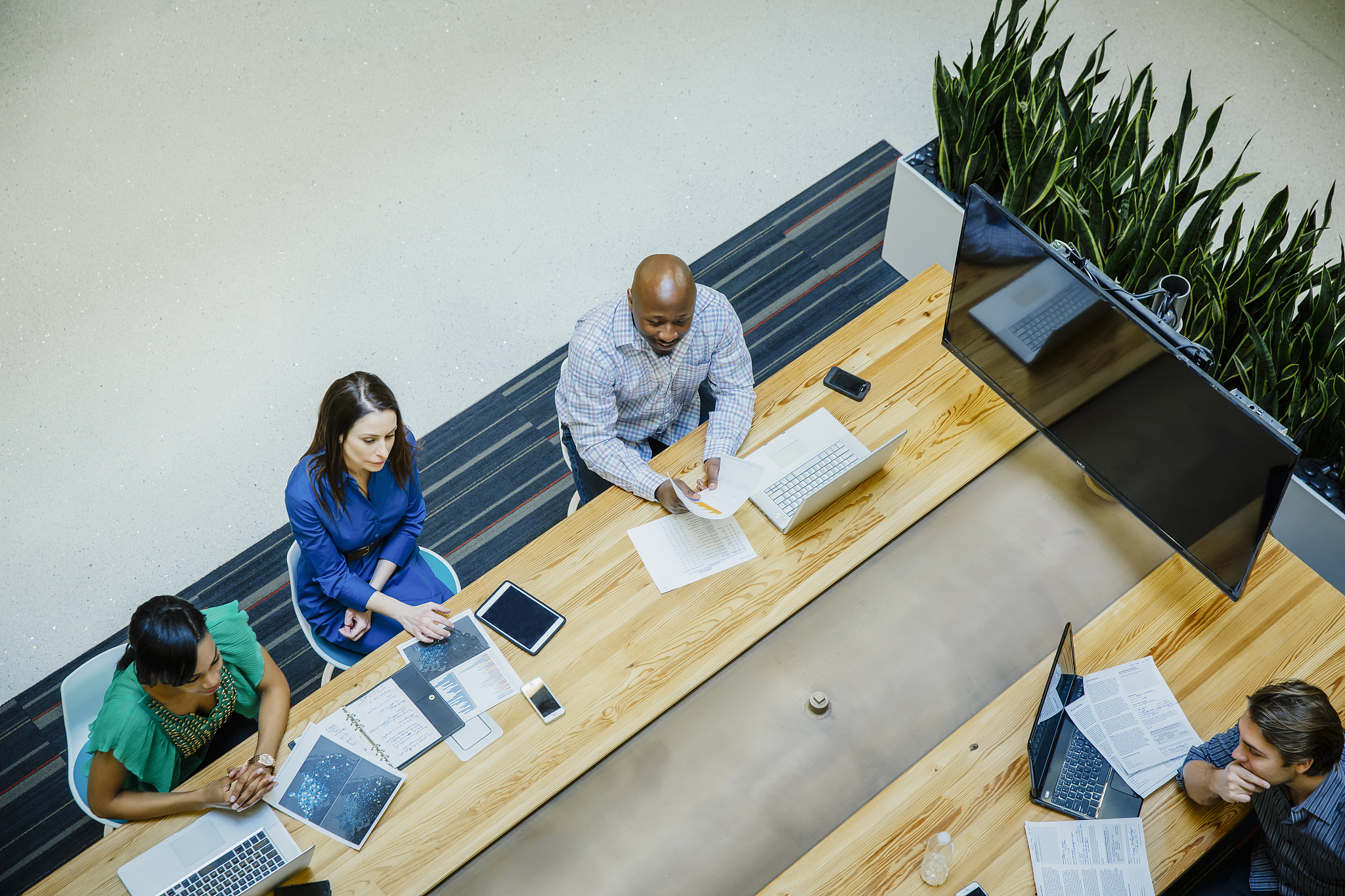 high angle view of business people working in office meeting