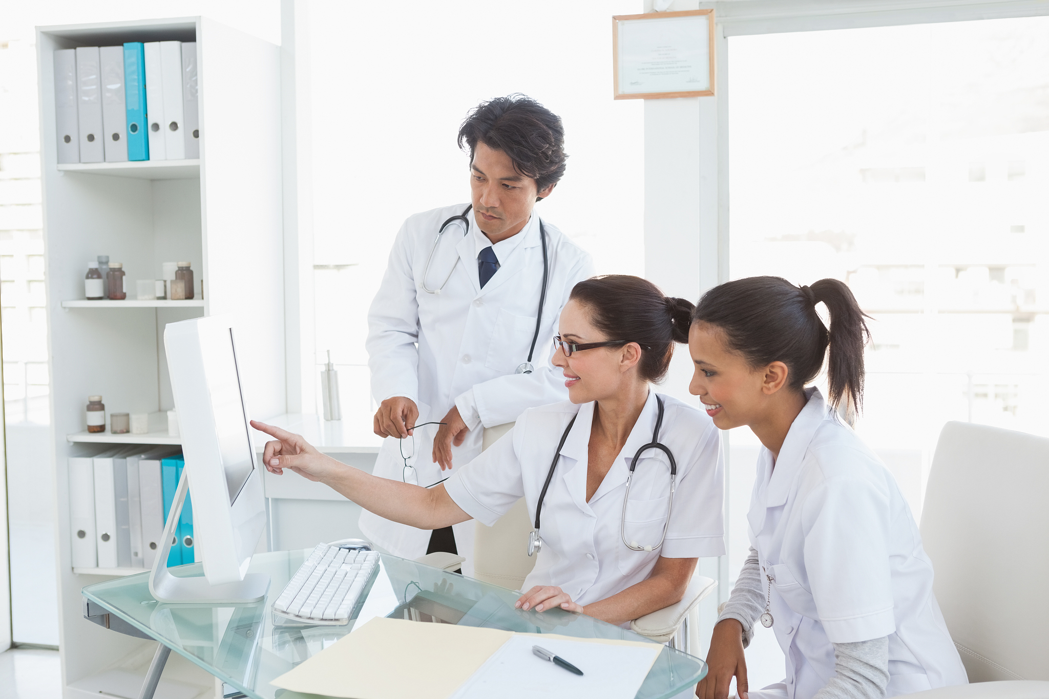 hard working doctors reviewing notes