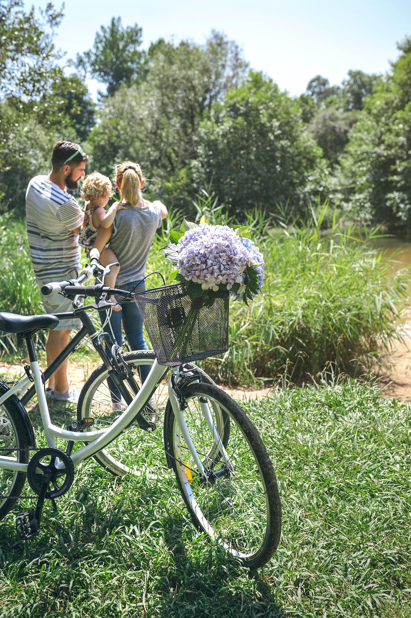 family with bicycle in the countryside