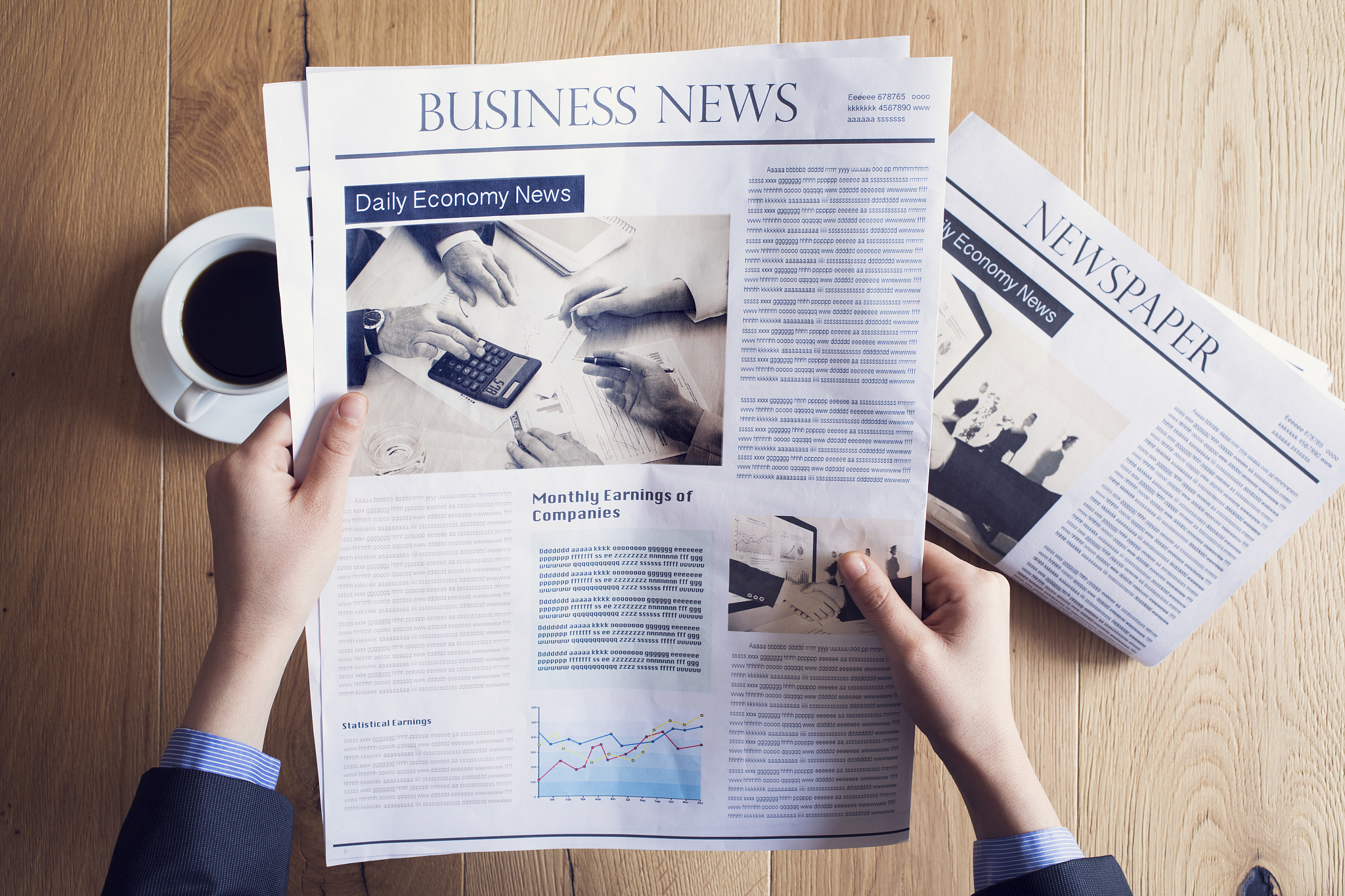 reading newspaper on desk