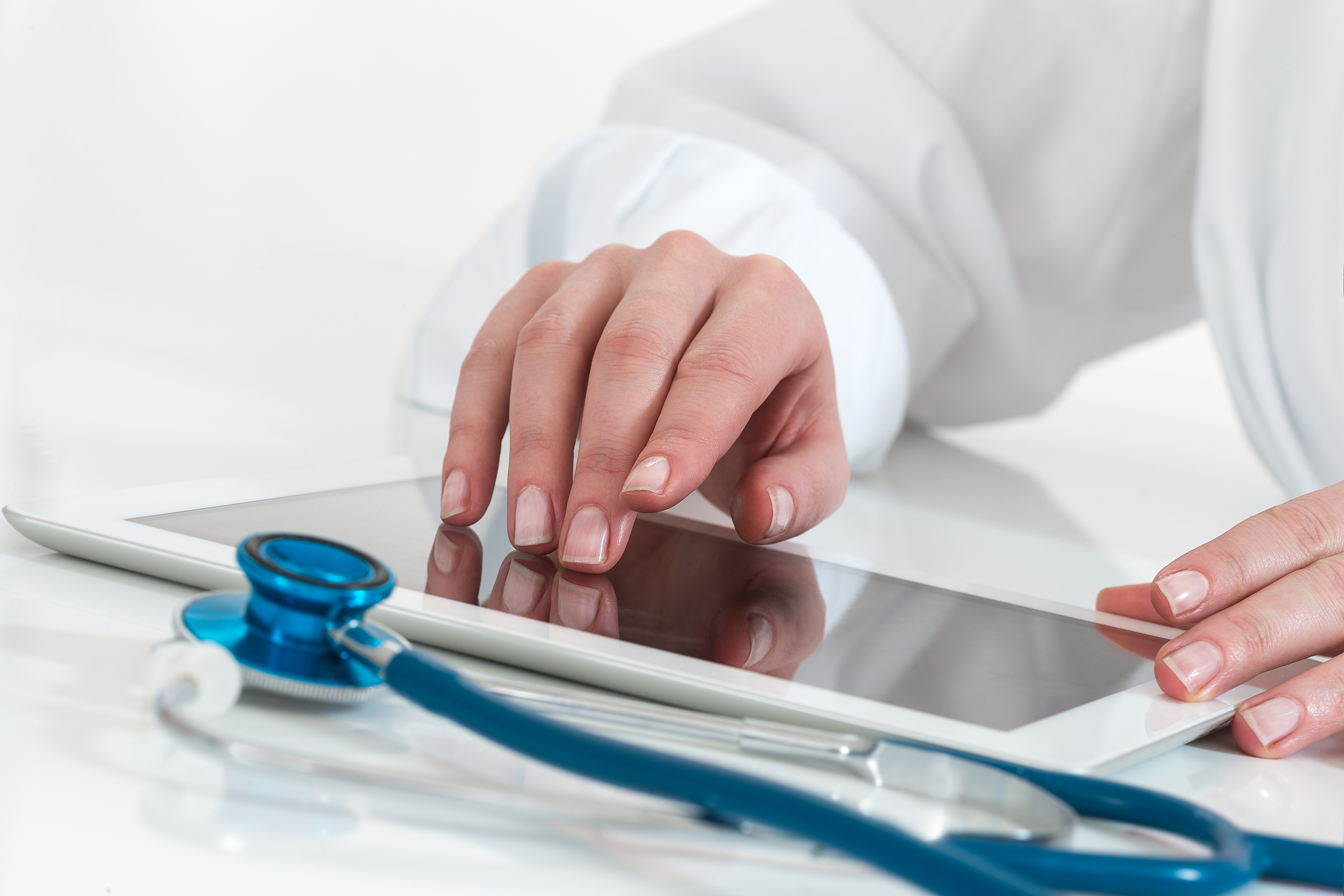 doctor working with digital tablet computer