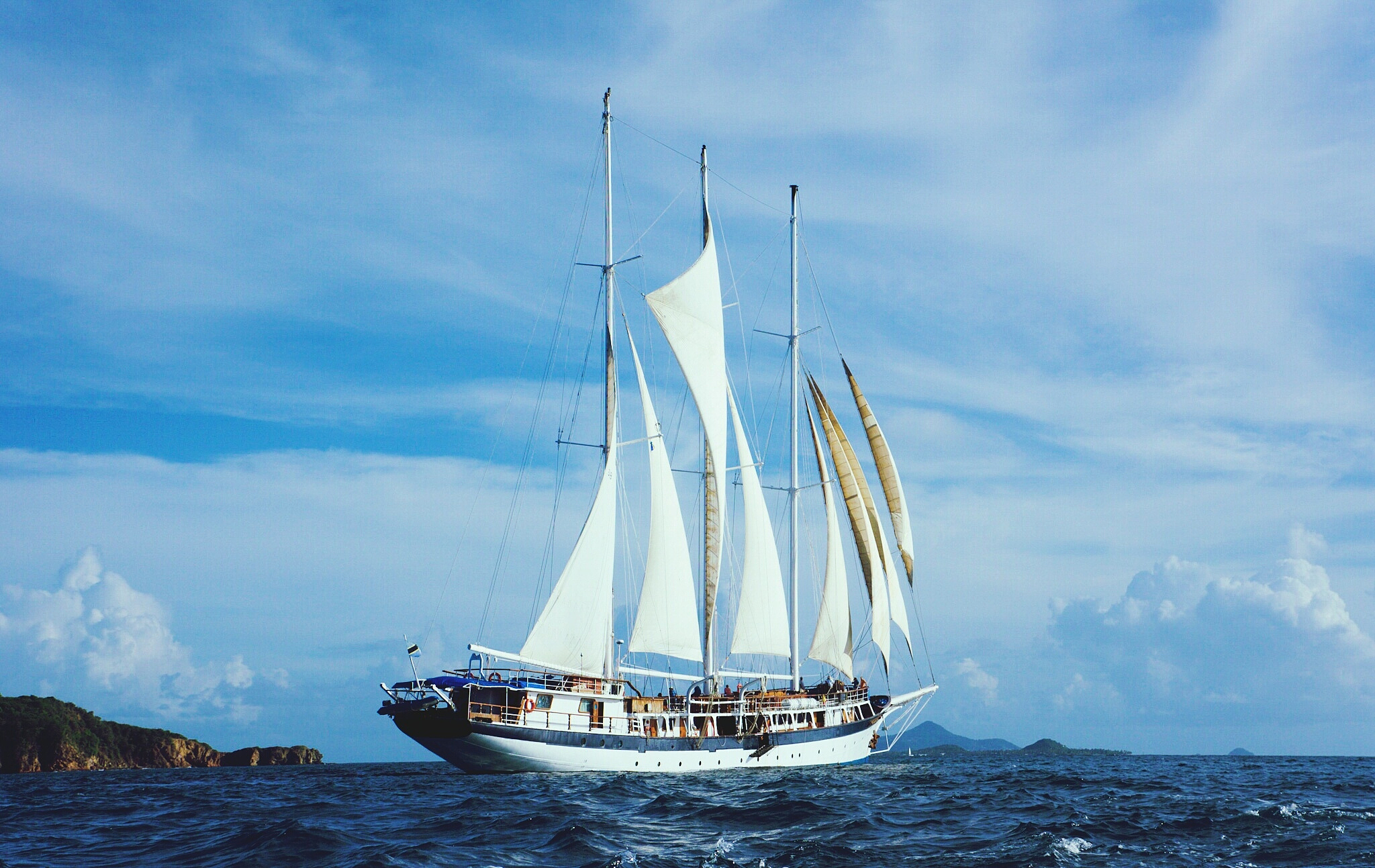 sailboat sailing on sea against sky