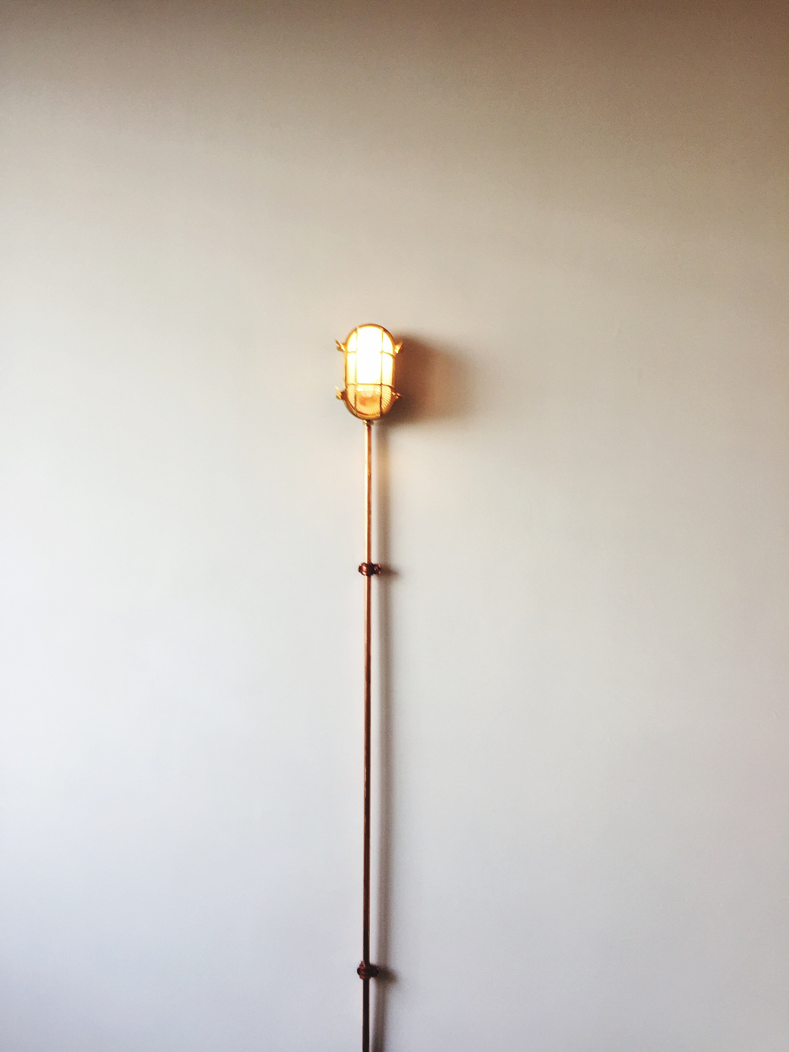 close-up of illuminated lamp against wall