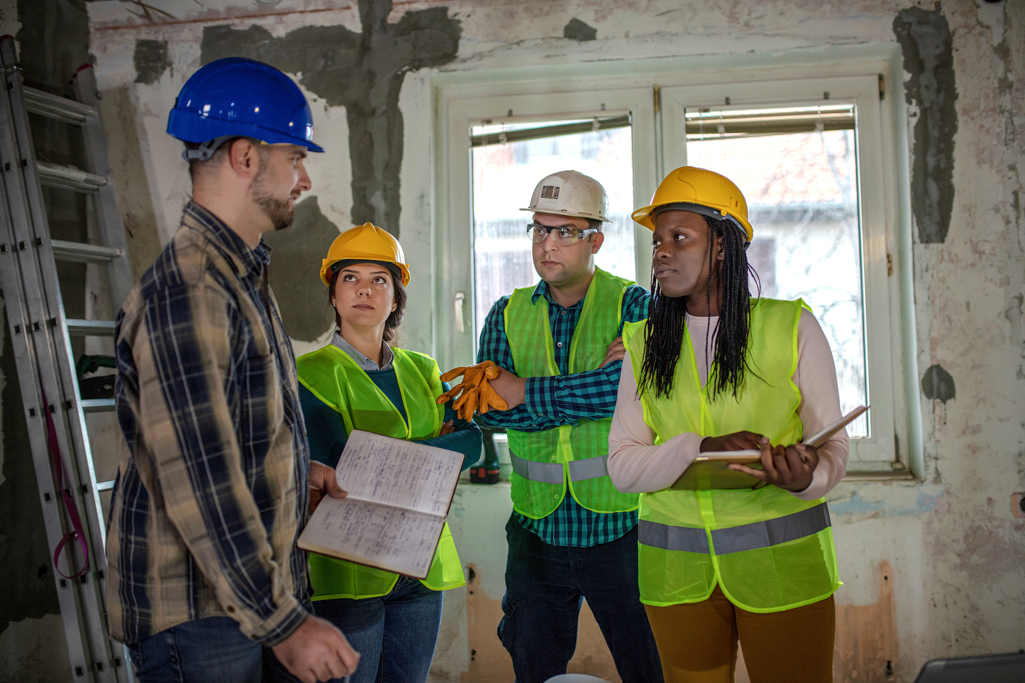 workers at construction job site inside building