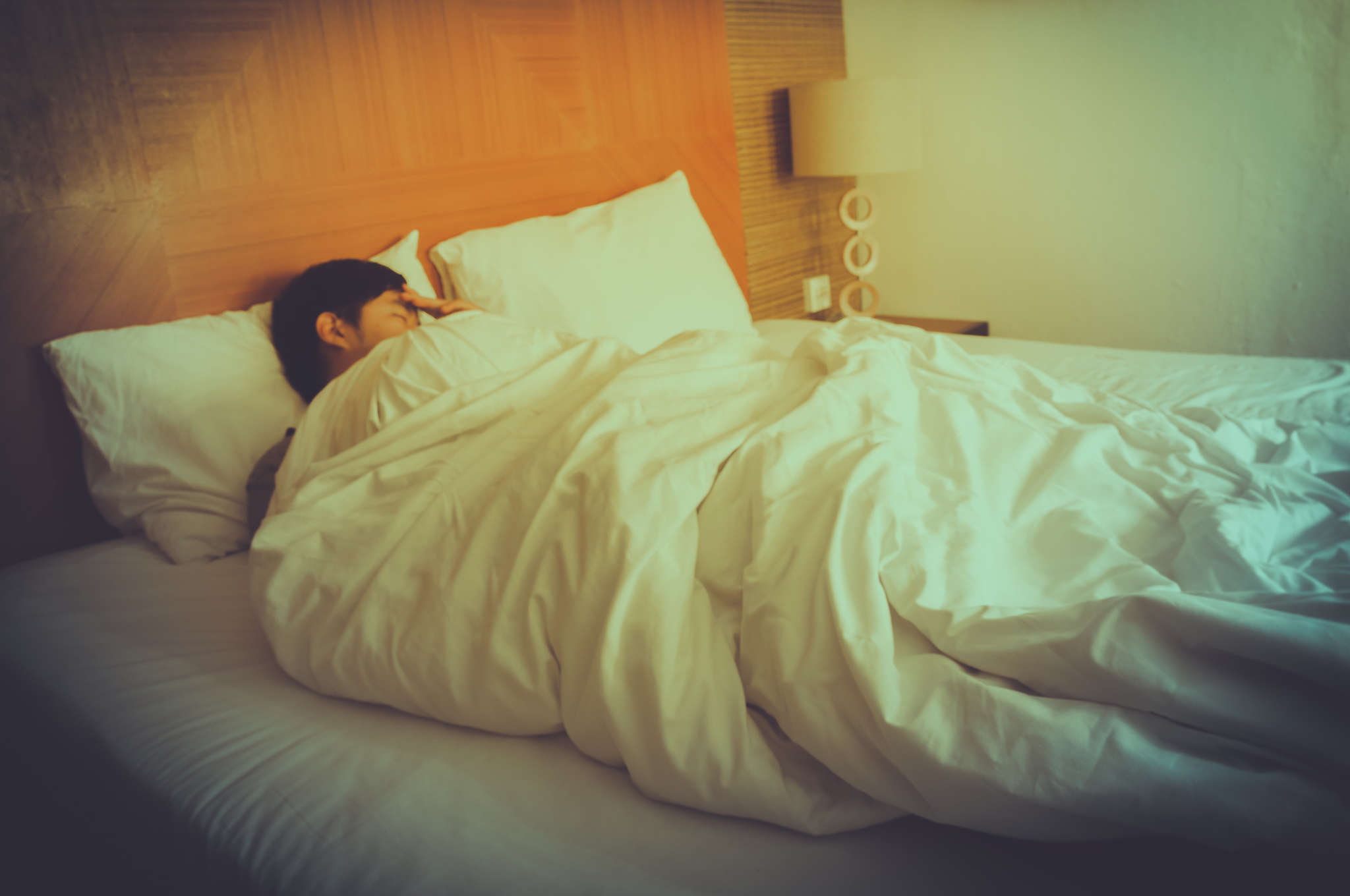 blurry sleeping young man, closed eyes, black hair with blurred