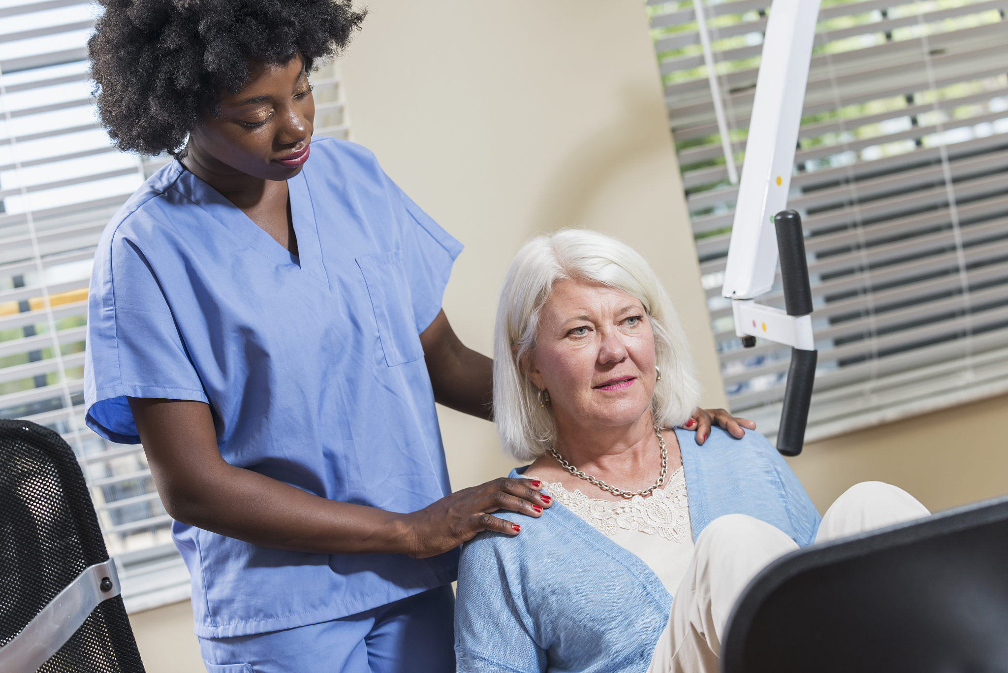 physical therapist working with a female patient