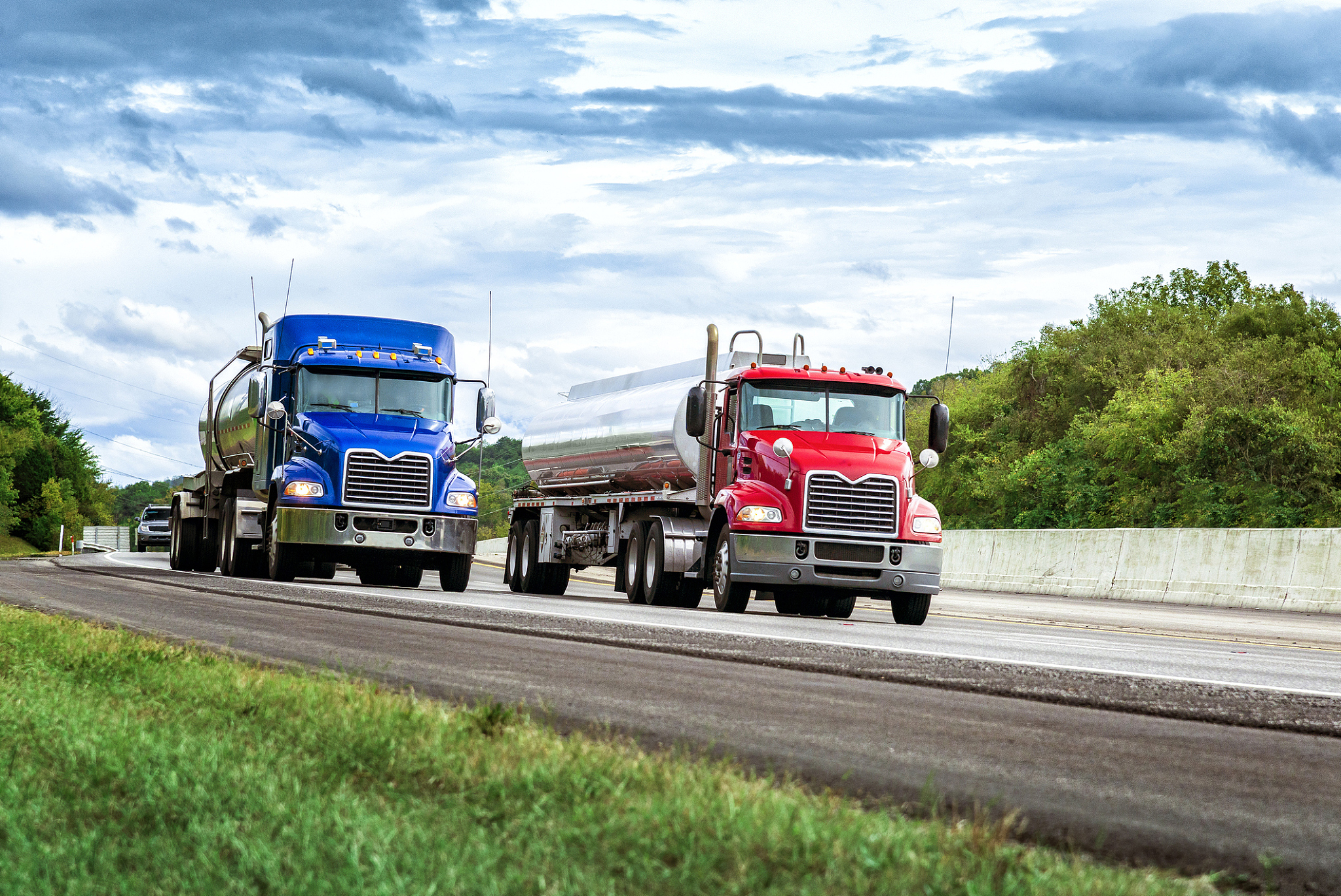 two gasoline tanker trucks on the interstate