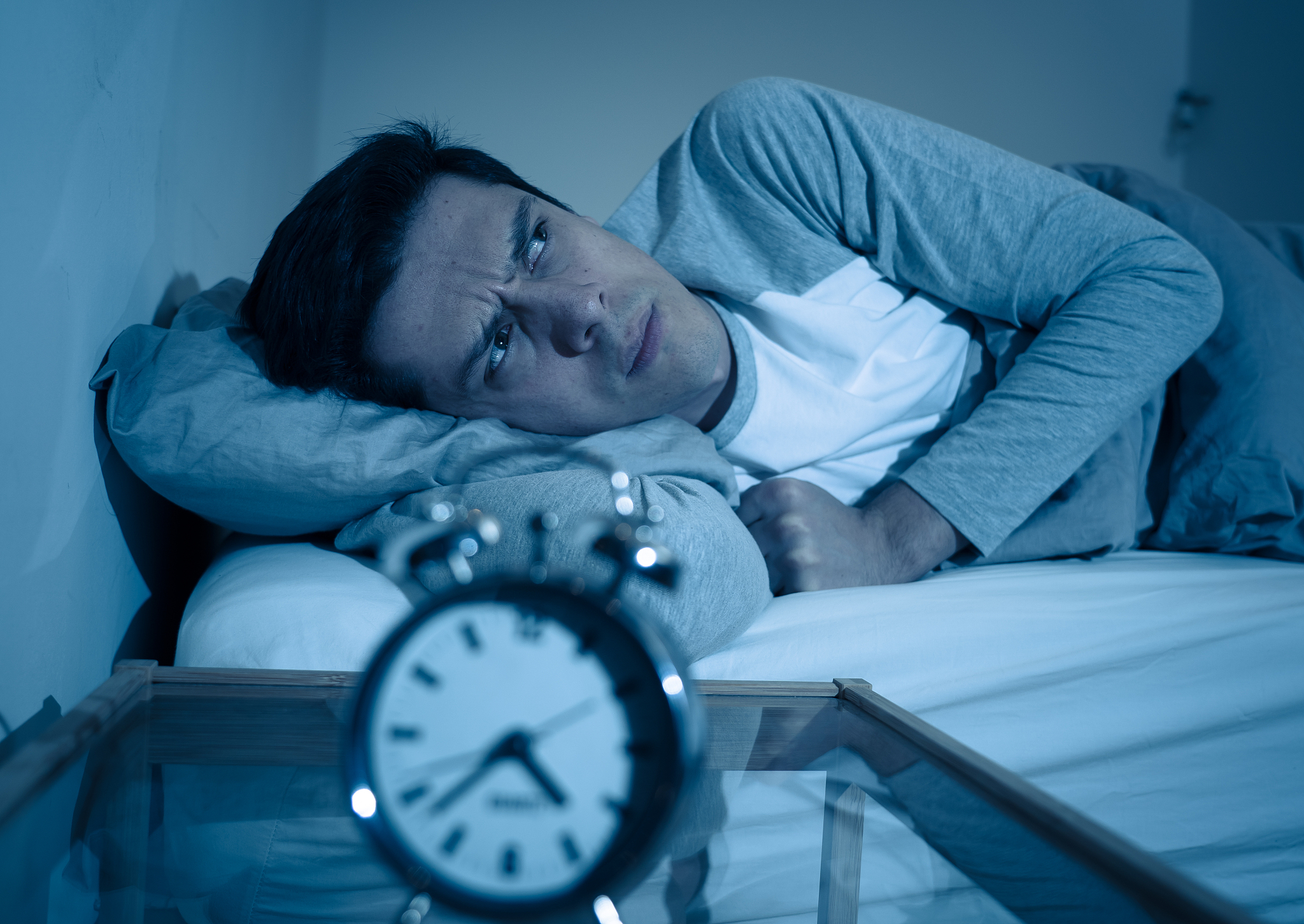 sleepless and desperate young caucasian man awake at night not a