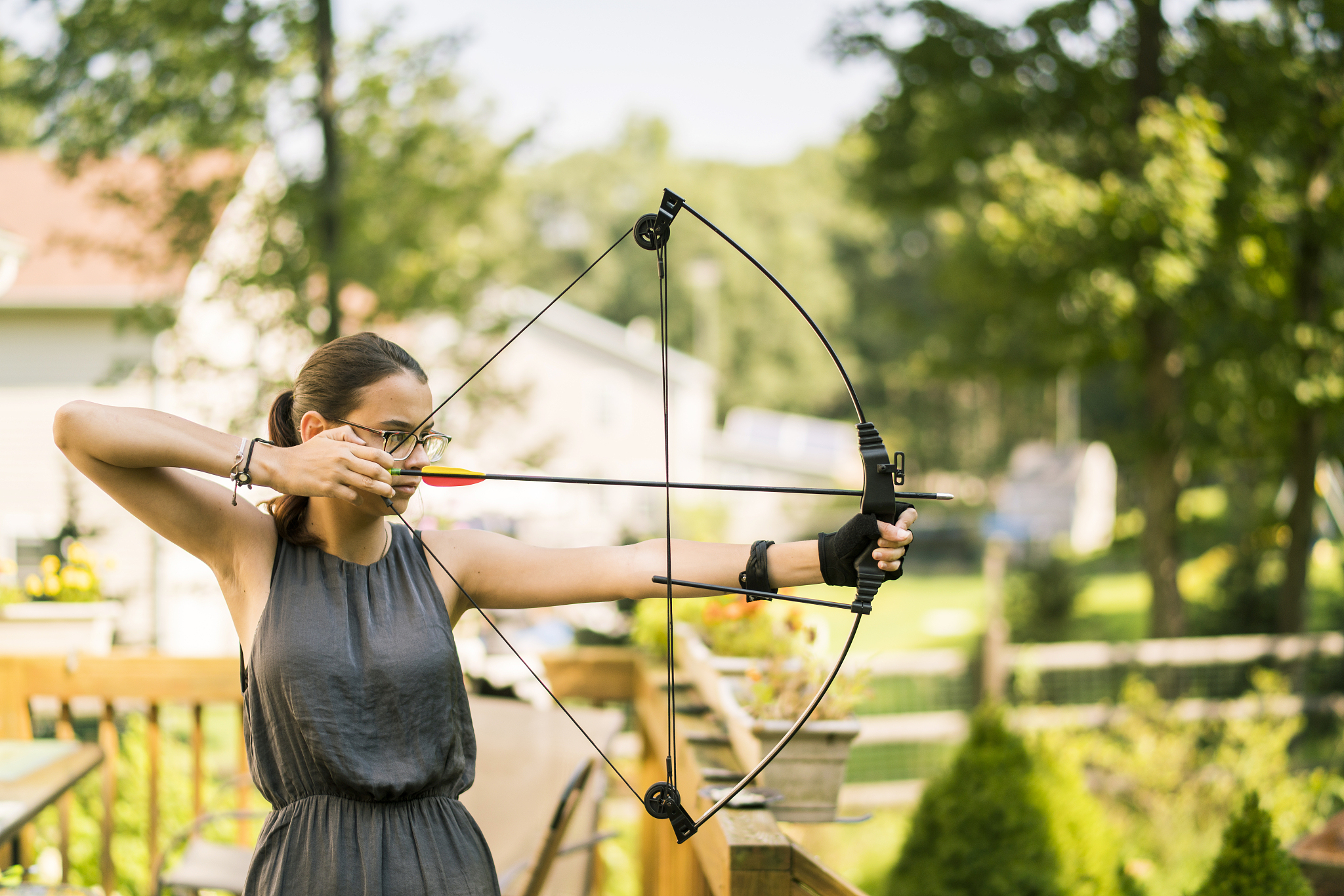the teenager girl practicing archery