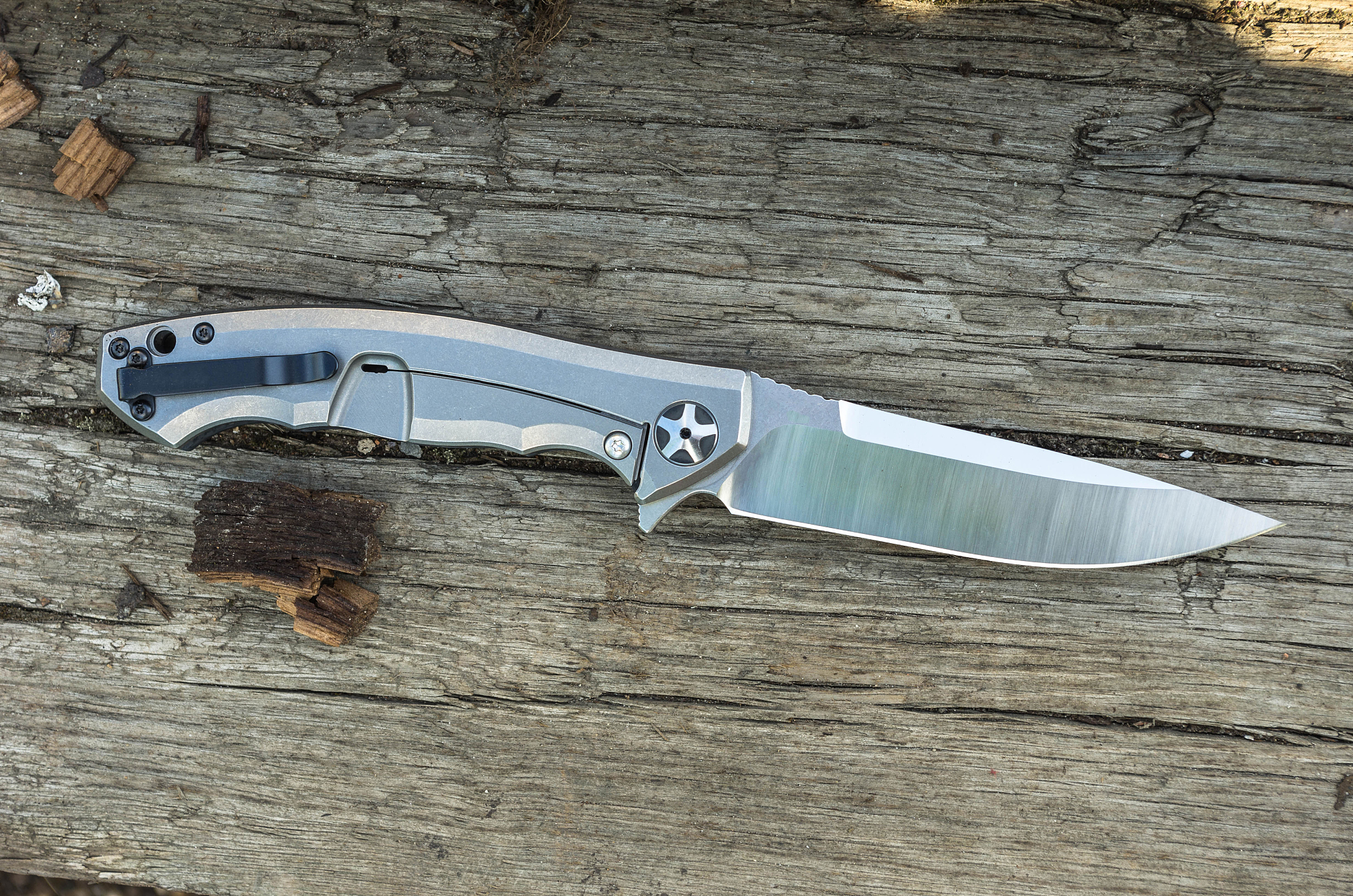 knife with a titanium handle photographed from top.