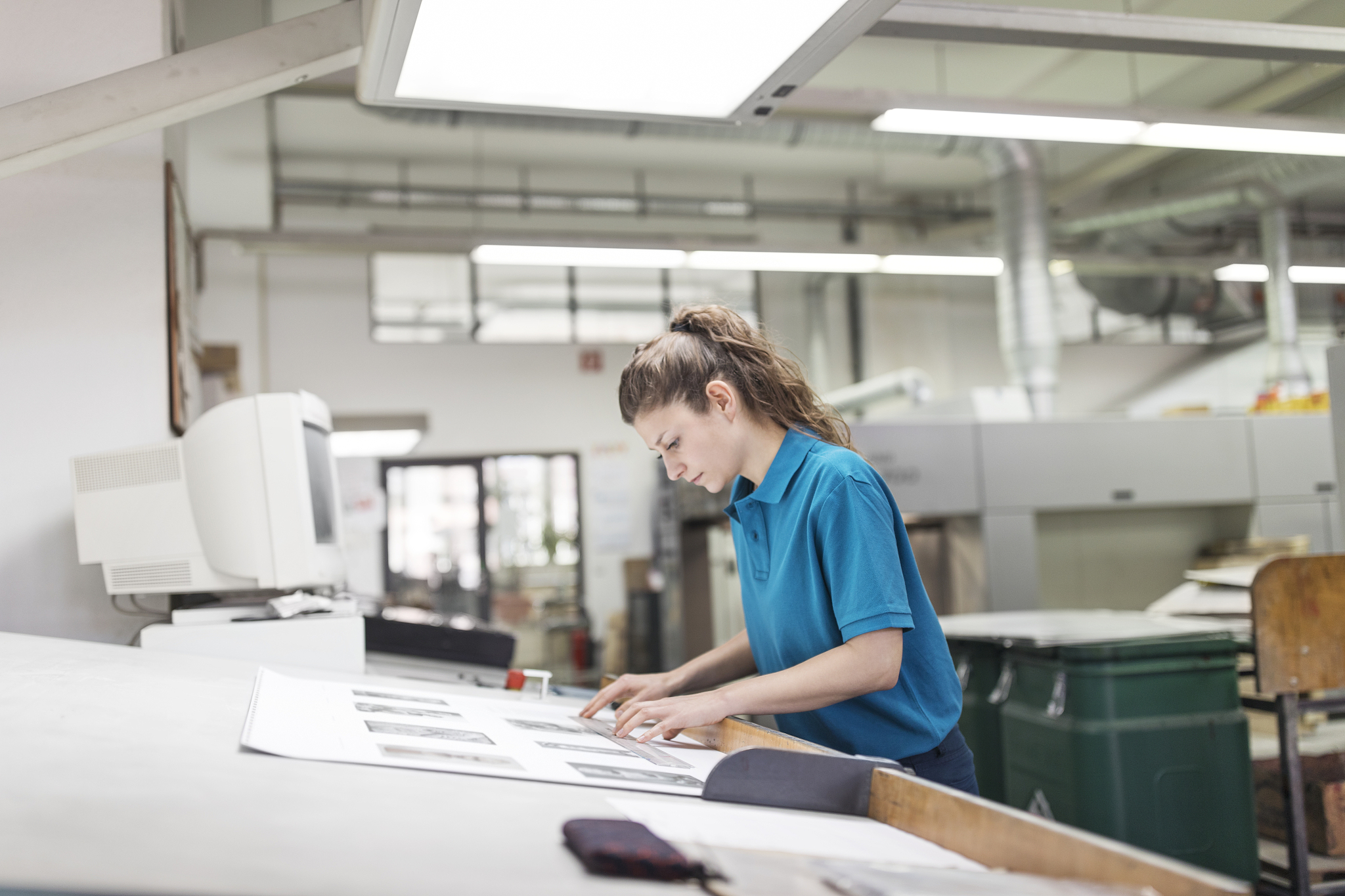 female designer working at printing factory