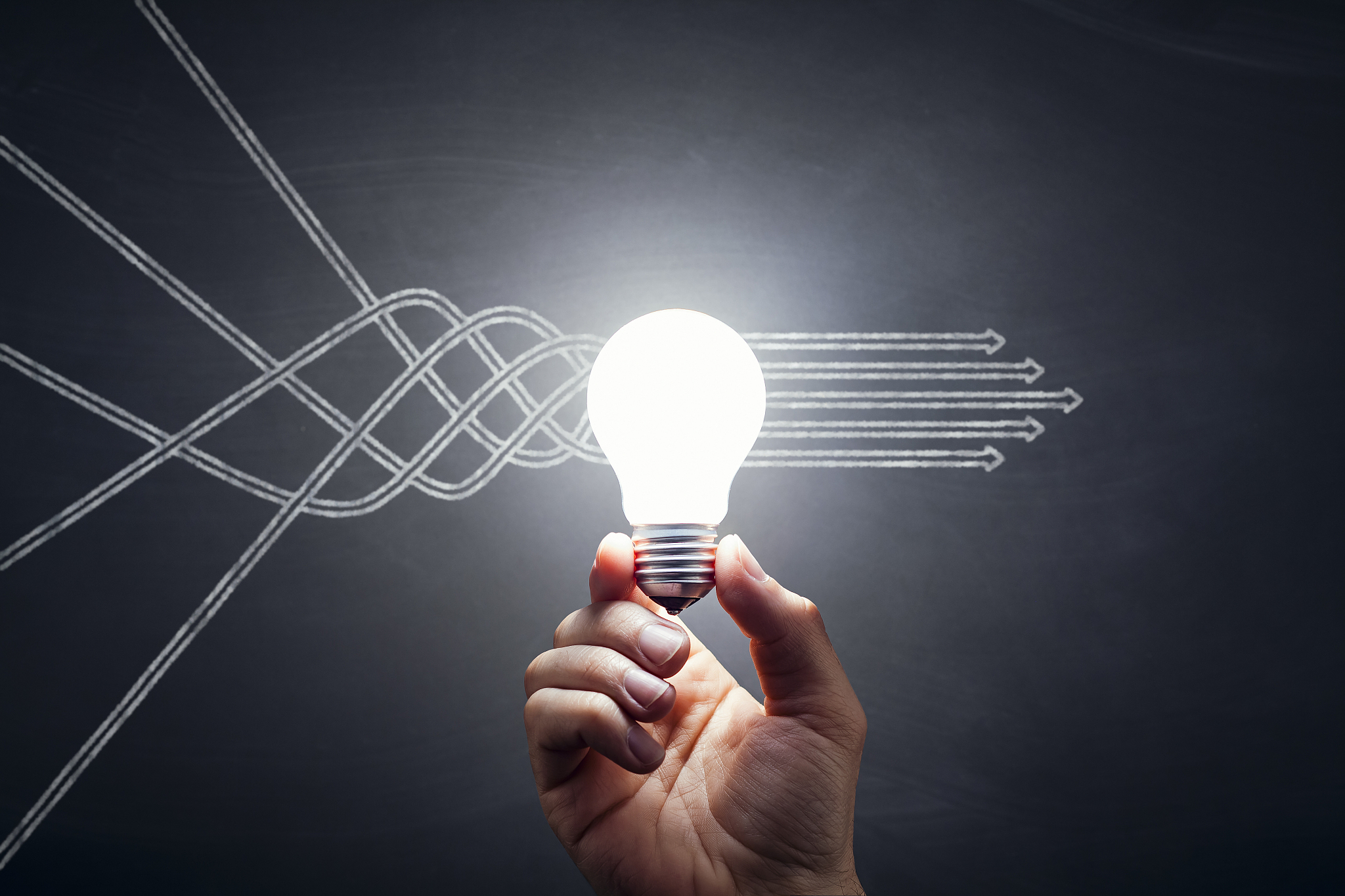 arrows - light bulb hand idea blackboard
