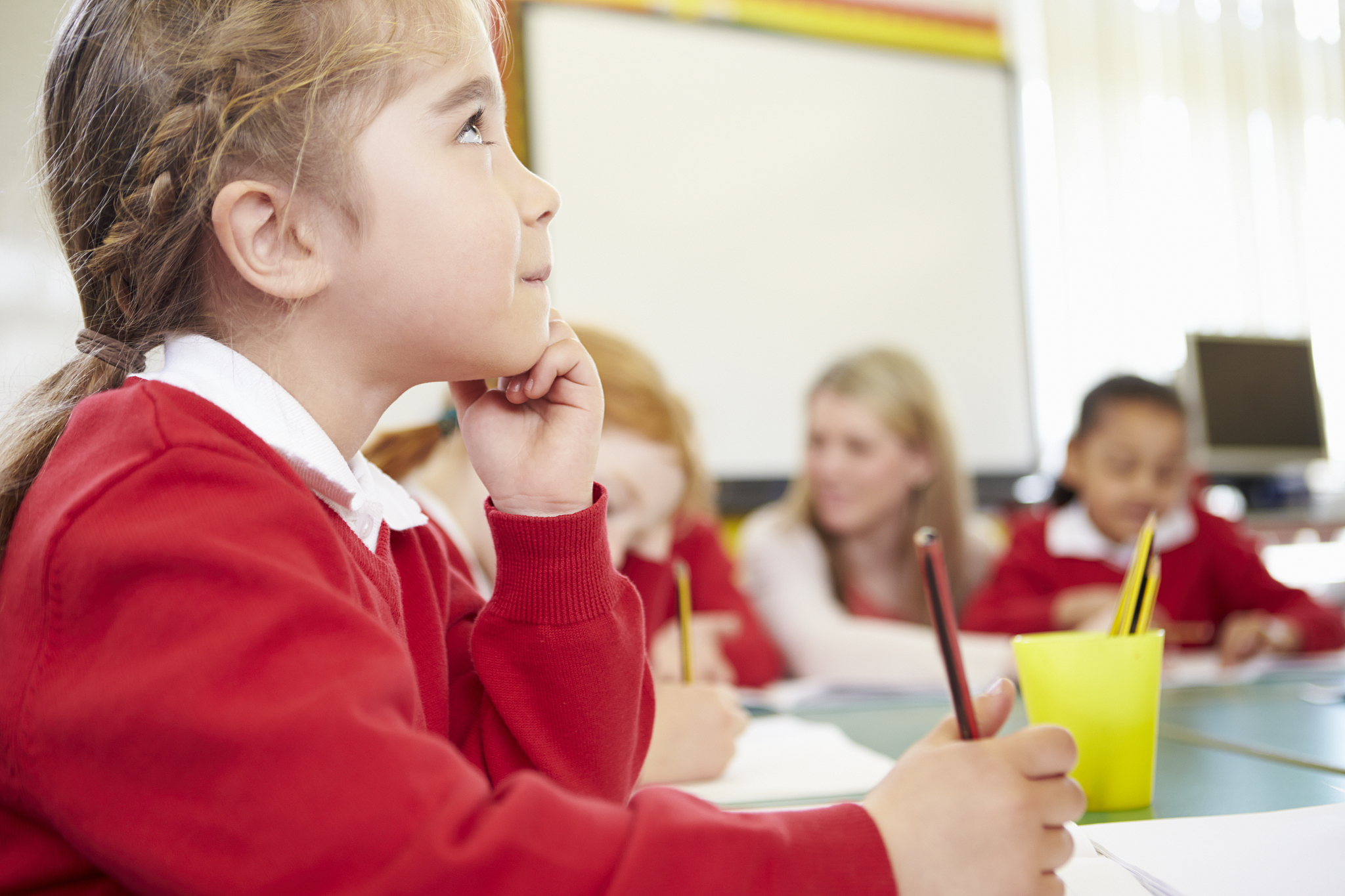 elementary pupil working at desk