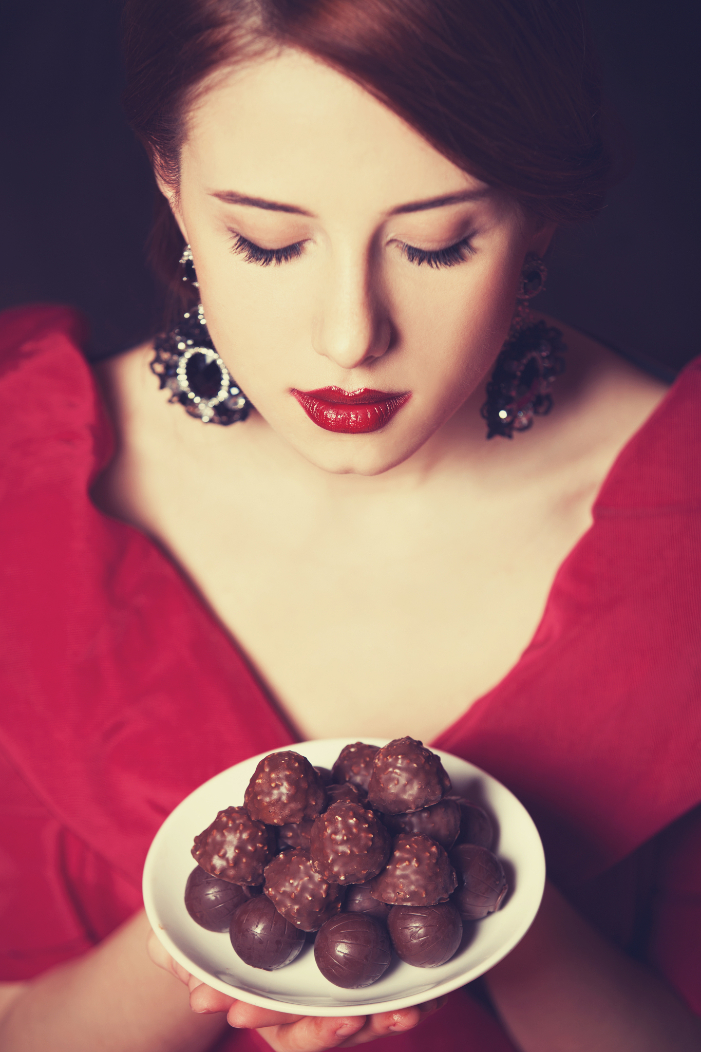 beautiful redhead women with candy.
