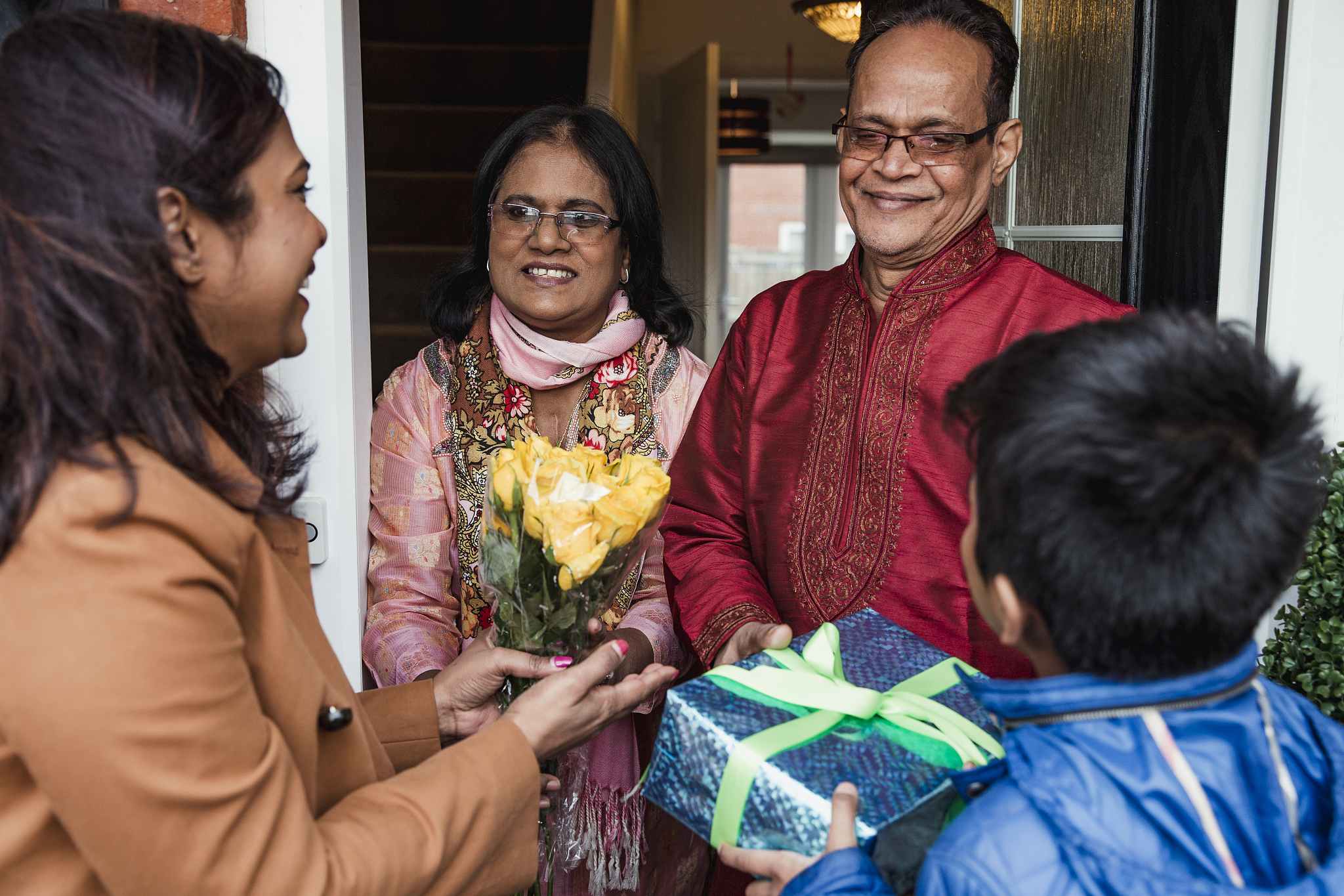 greeting family with gifts