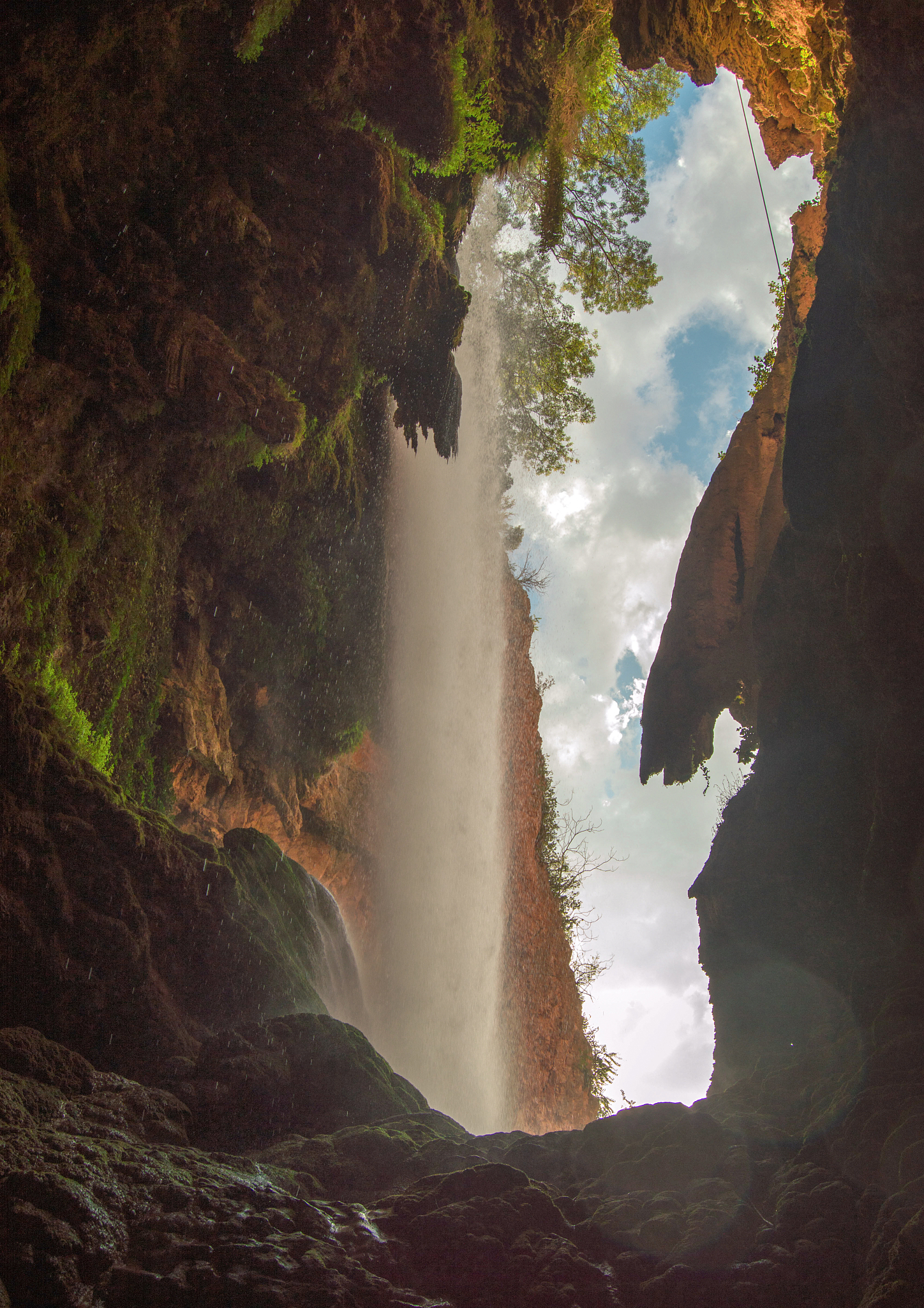 waterfall from inside a cave