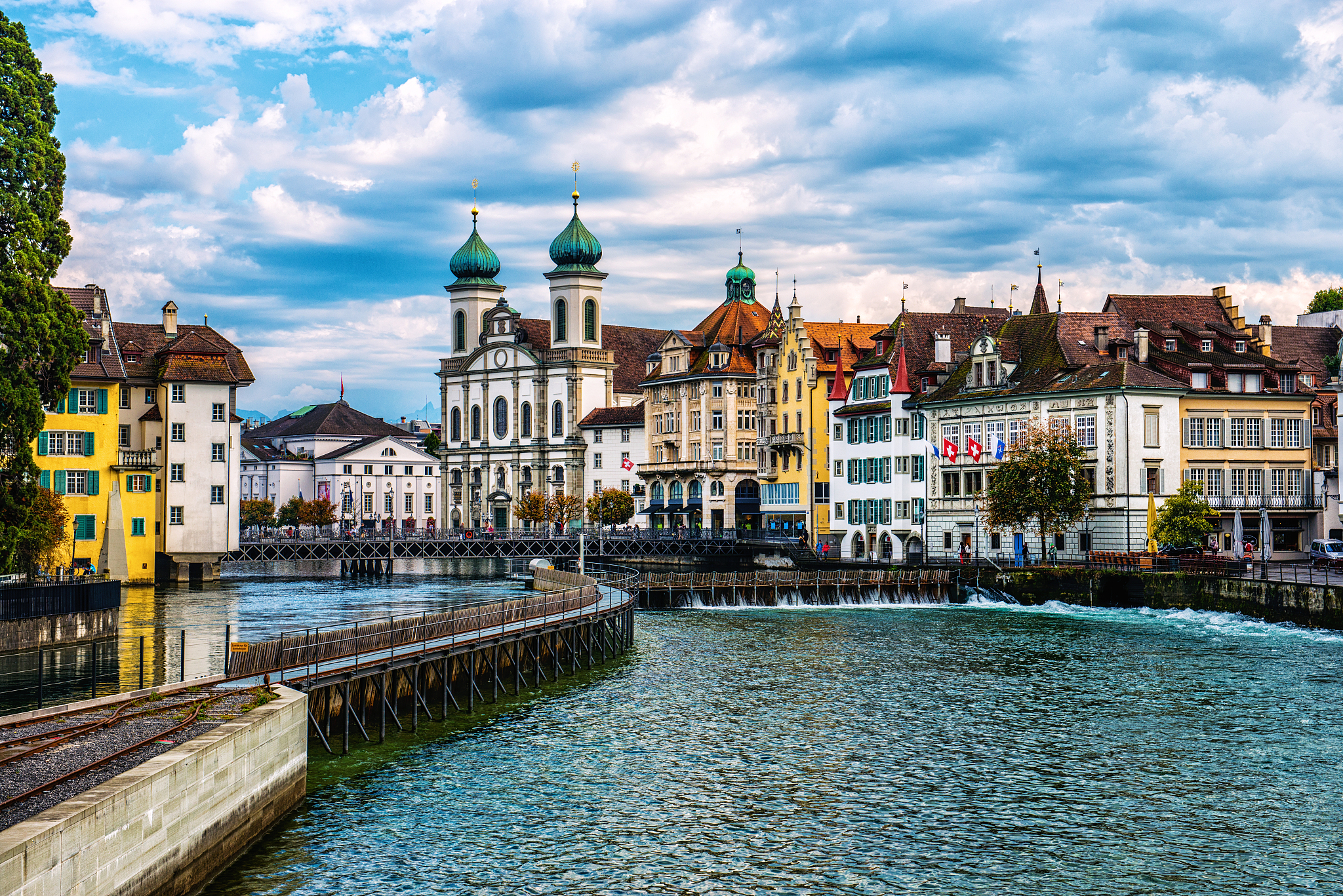 jesuit church and reuss river in old town lucerne, switzerland