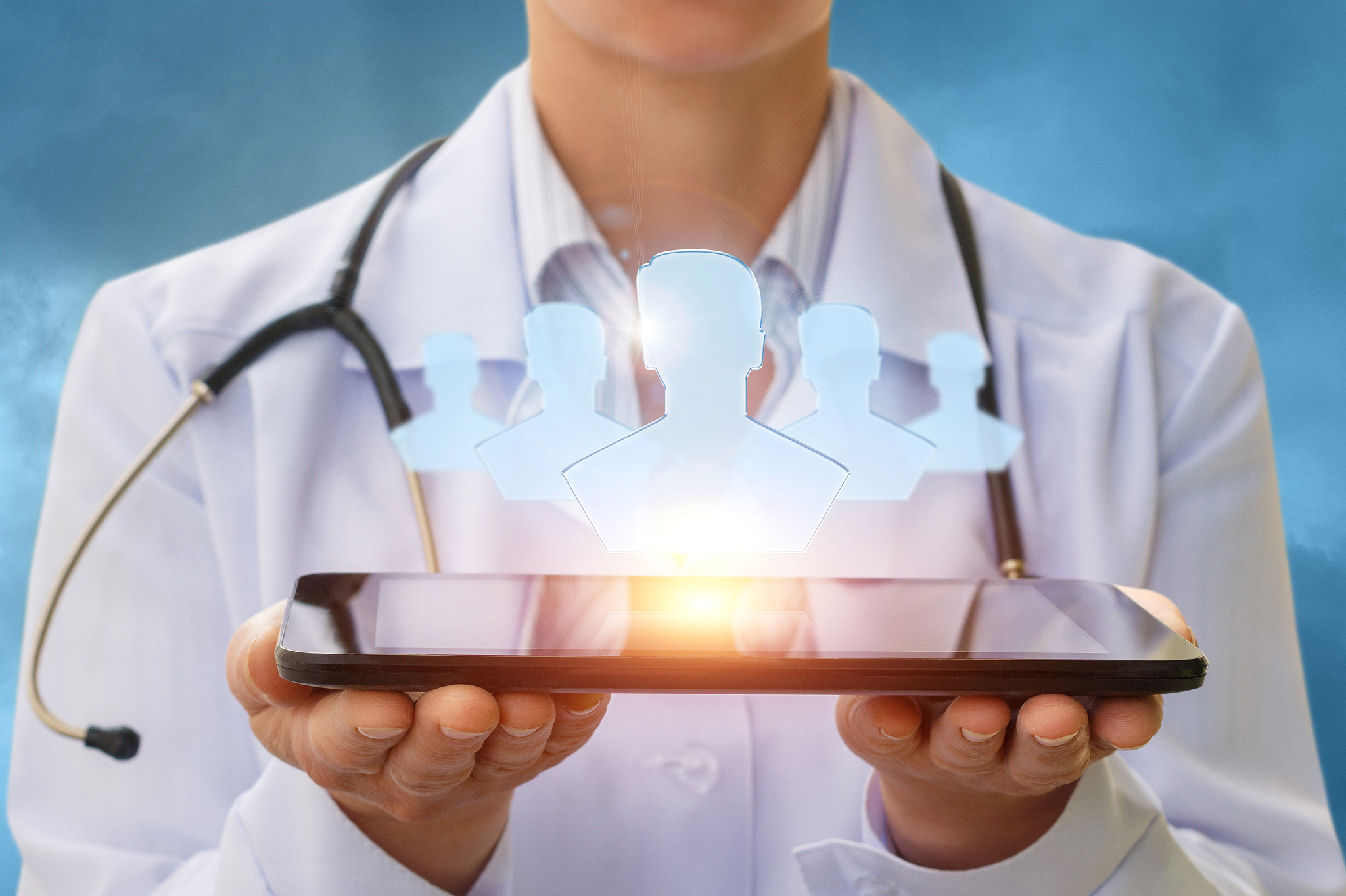 doctor and the patients on the screen of the tablet.
