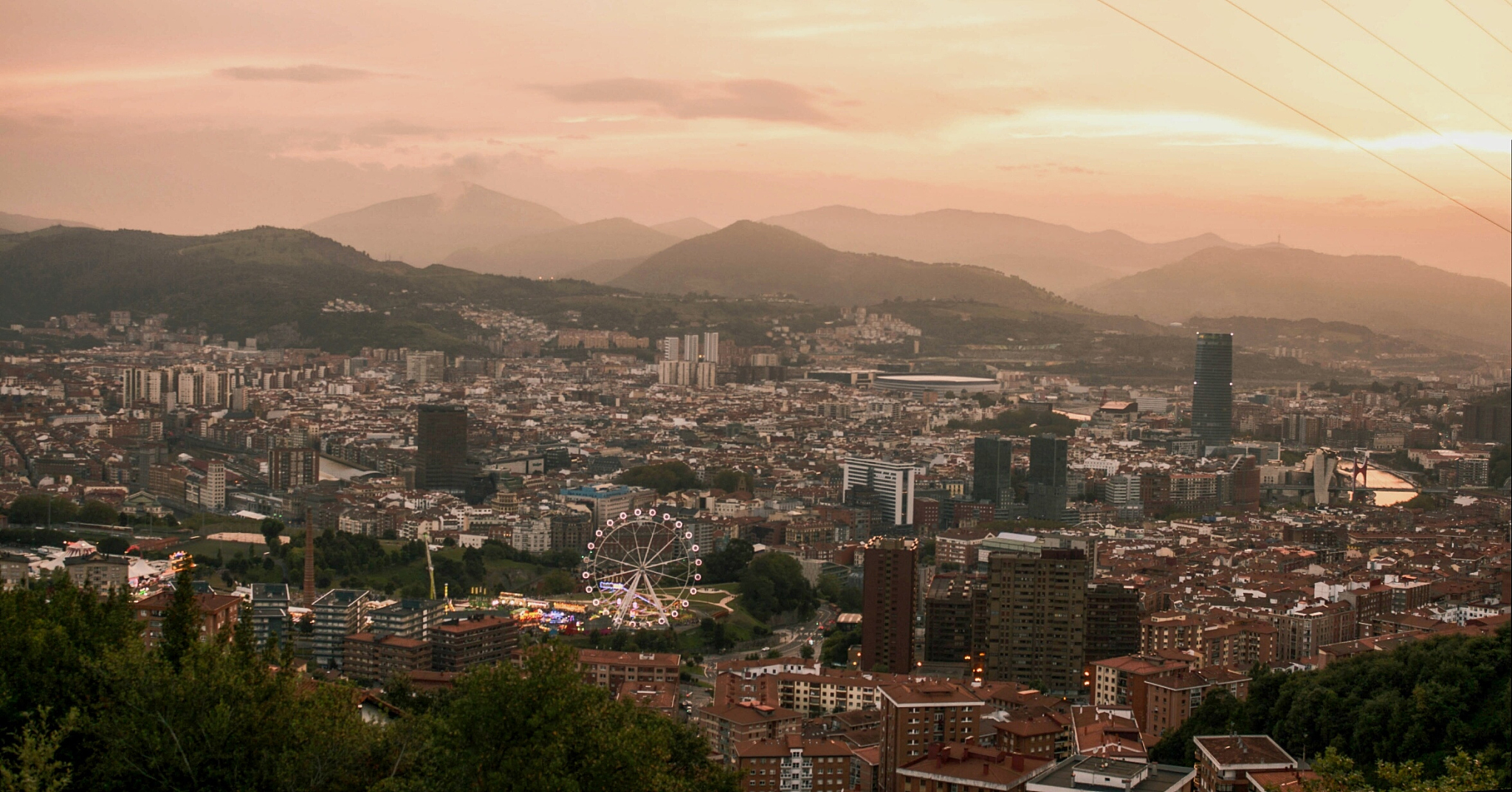 aerial view of cityscape against sky during sunset