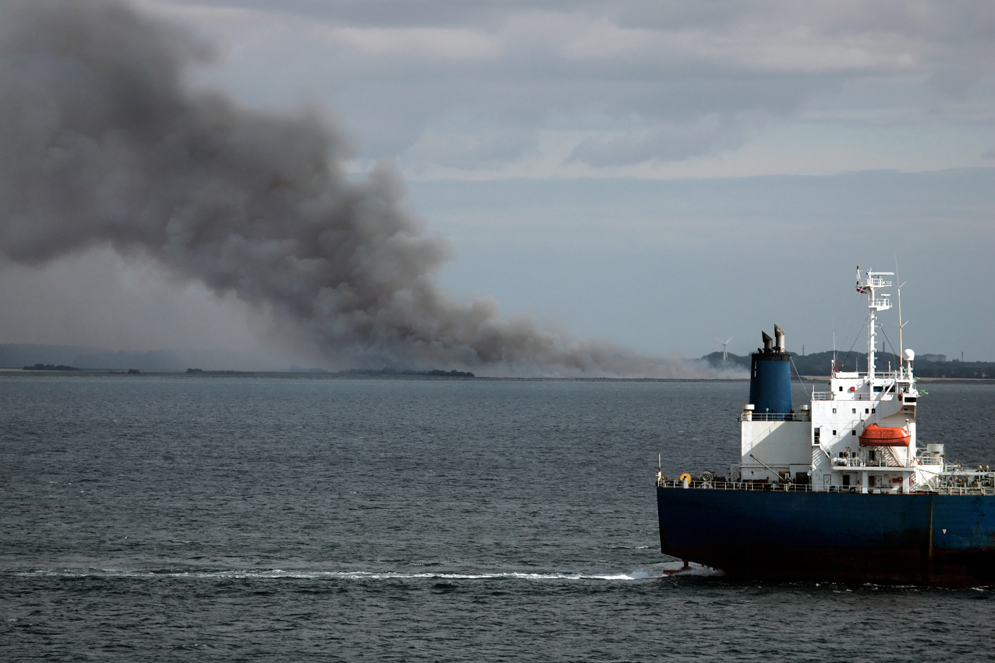 Ship Deck and Hull Oil Pollution Clean-up in Progress - Preventing Sea Contamination