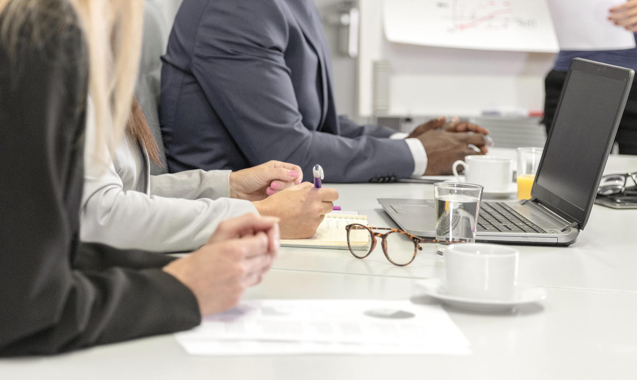 hands of business people on a table