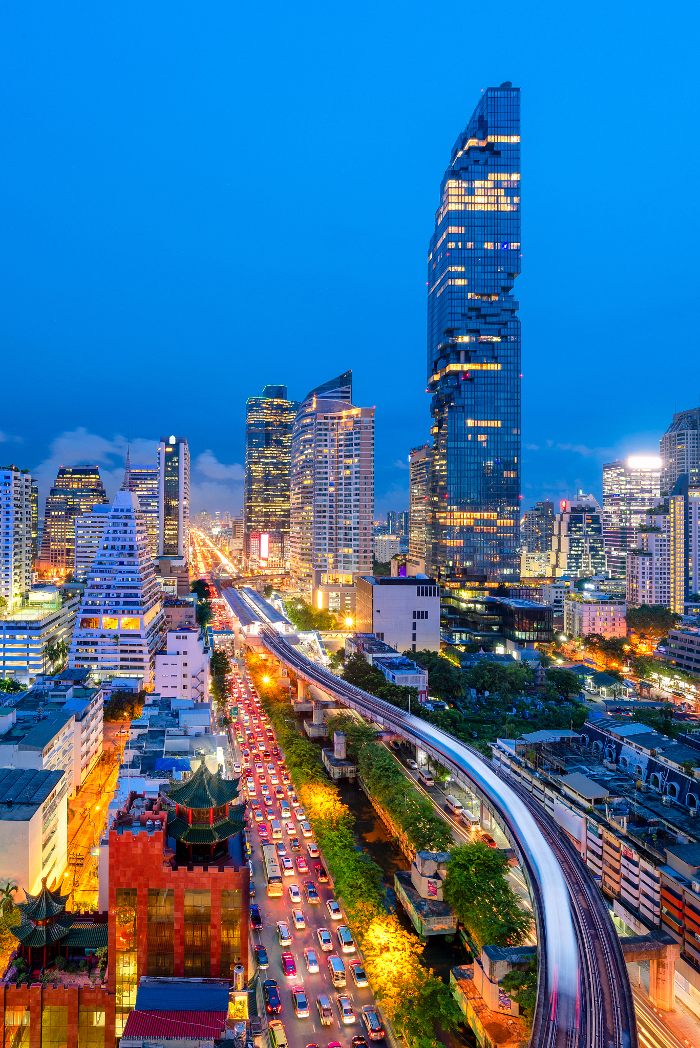 modern office building in business area with traffic during rush