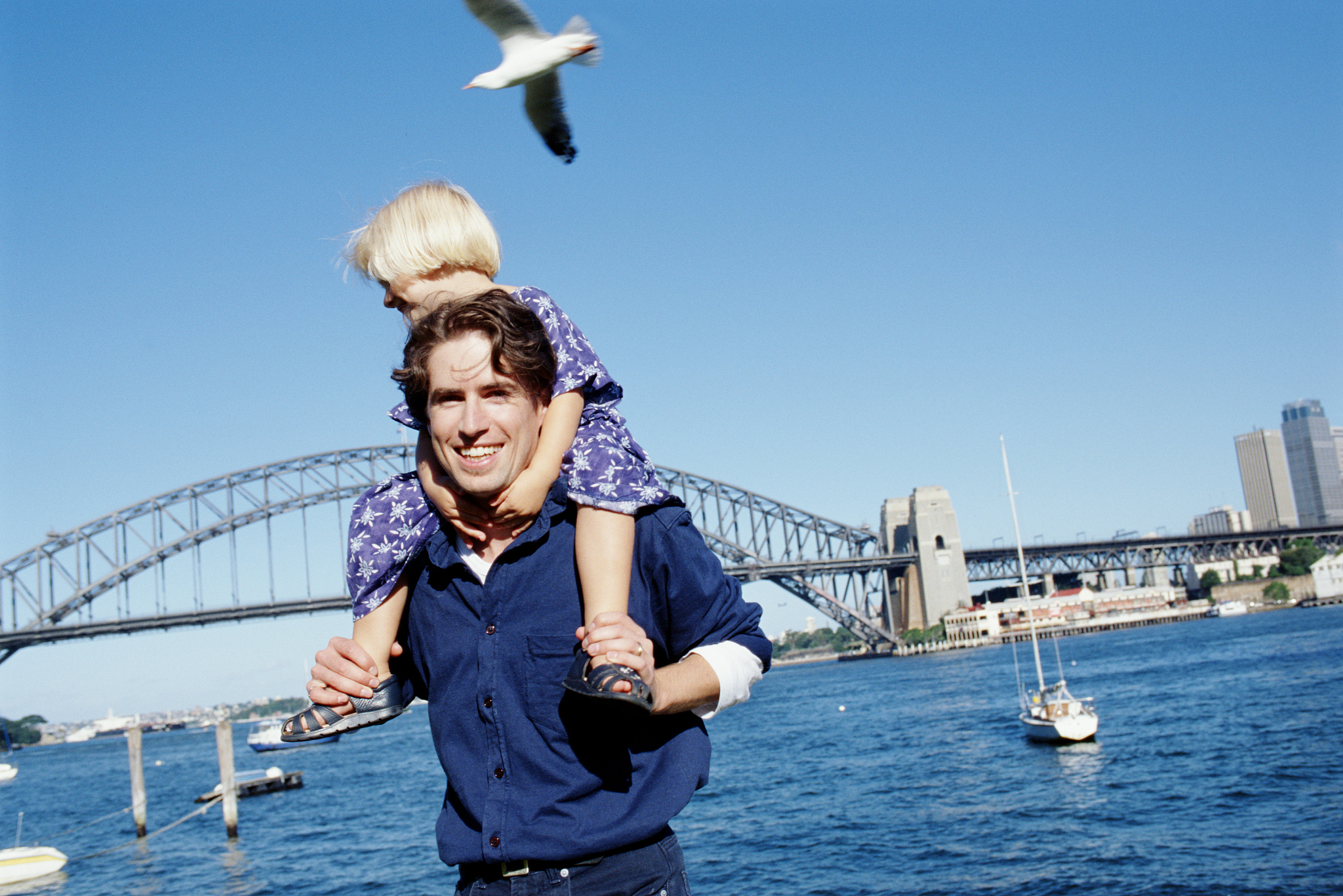 man with child on shoulders, sydney