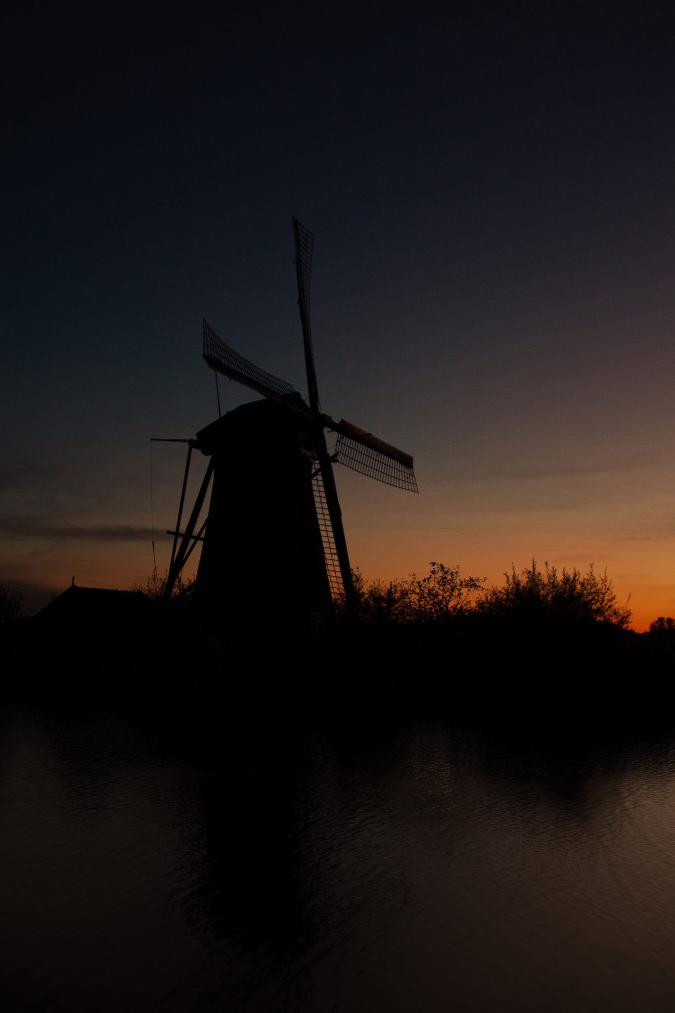 the sunset view of traditional dutch windmill in kinderdijk, net