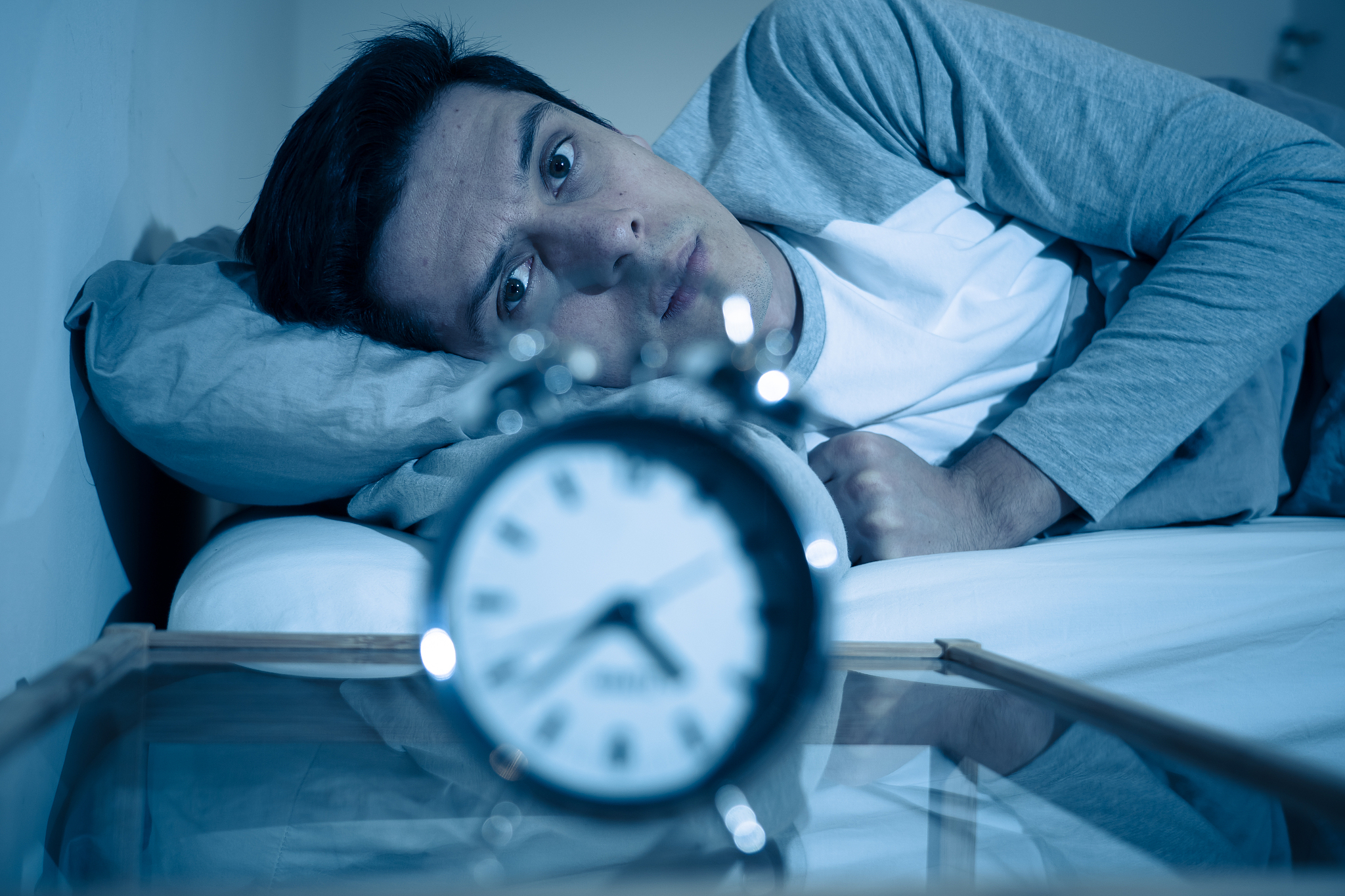 sleepless and desperate young caucasian man awake at night not a