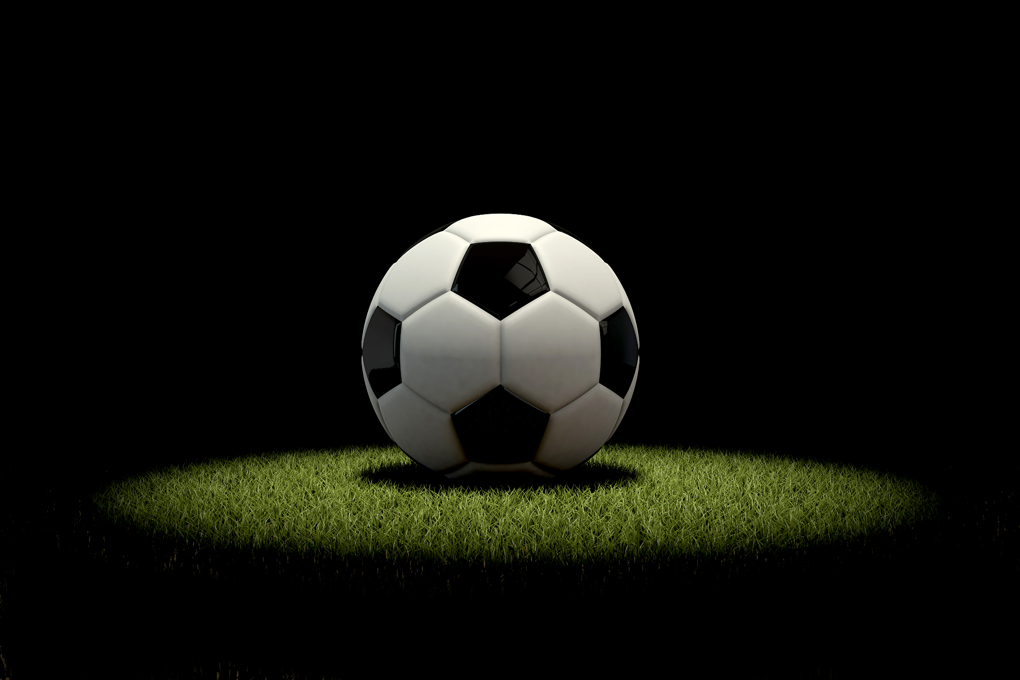 football soccer ball in a spotlight