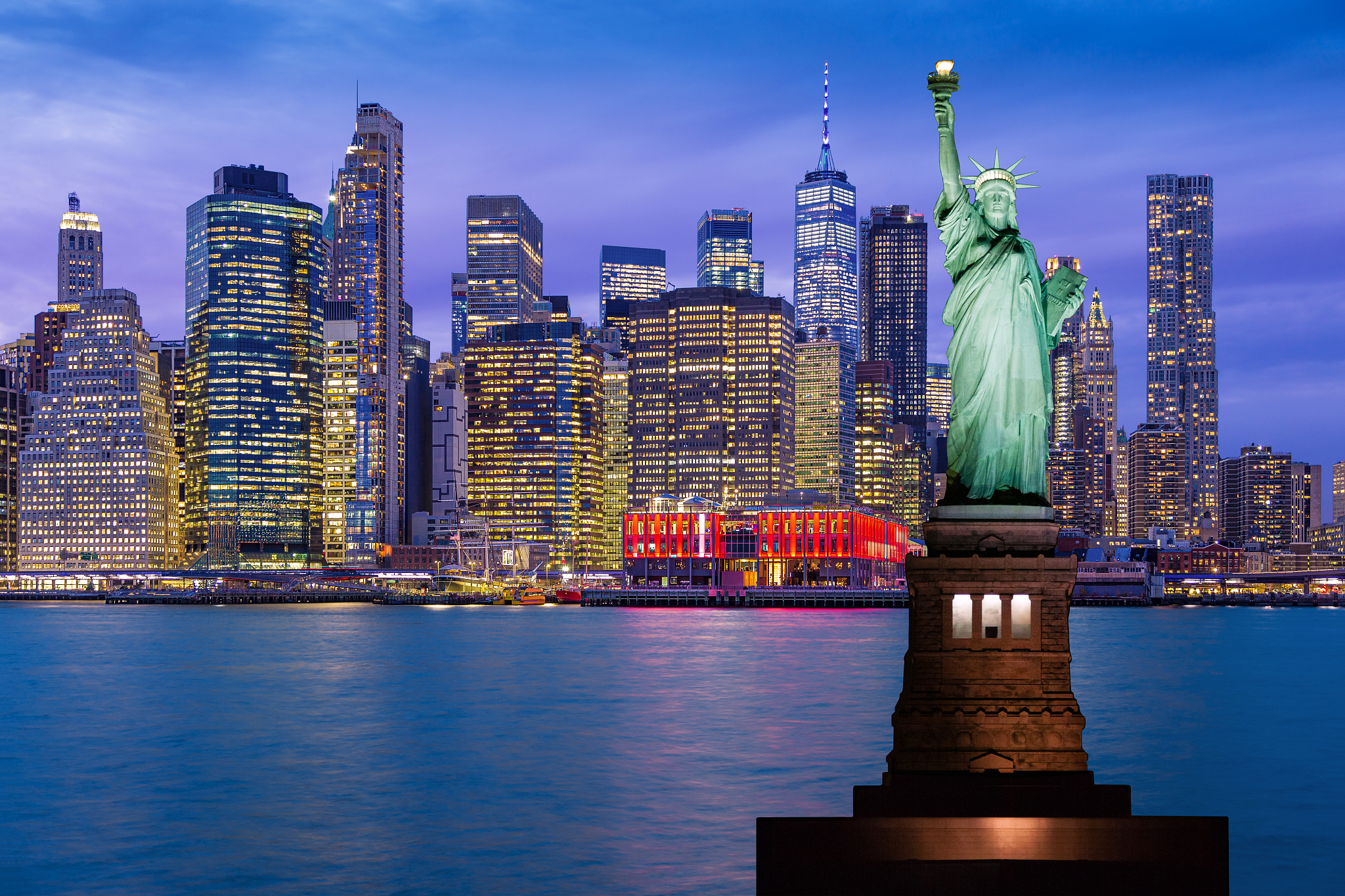 statue of liberty and new york city skyline with manhattan finan