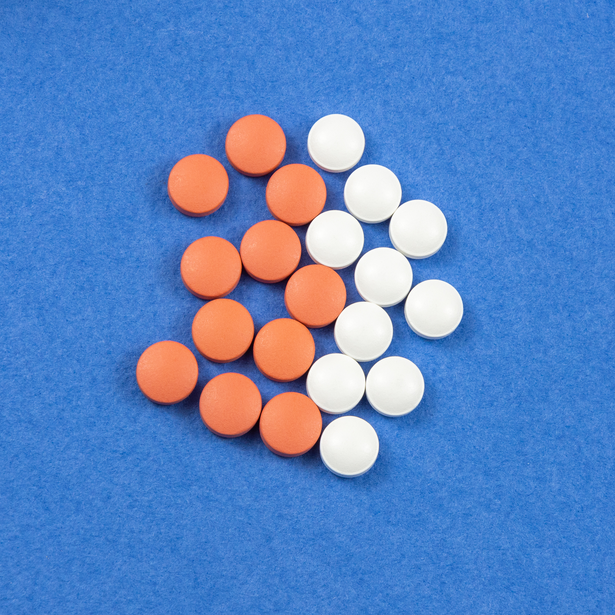 pills and vitamins on a blue background