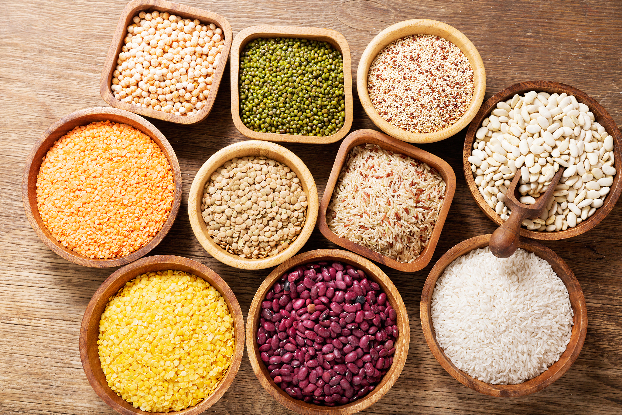bowls of legumes, lentils, chickpeas, rice and beans