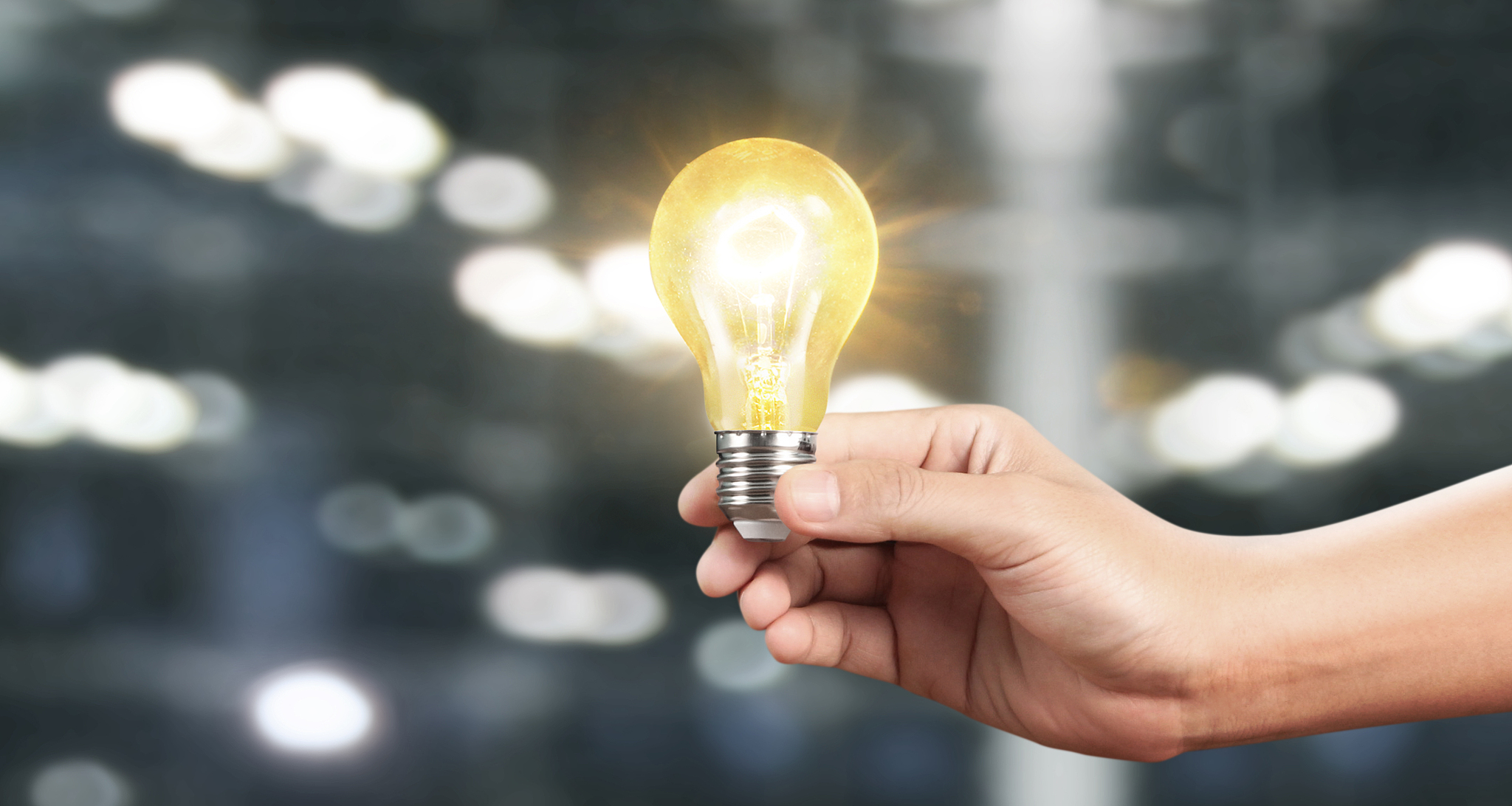 hand of holding illuminated light bulb, innovation inspiration c