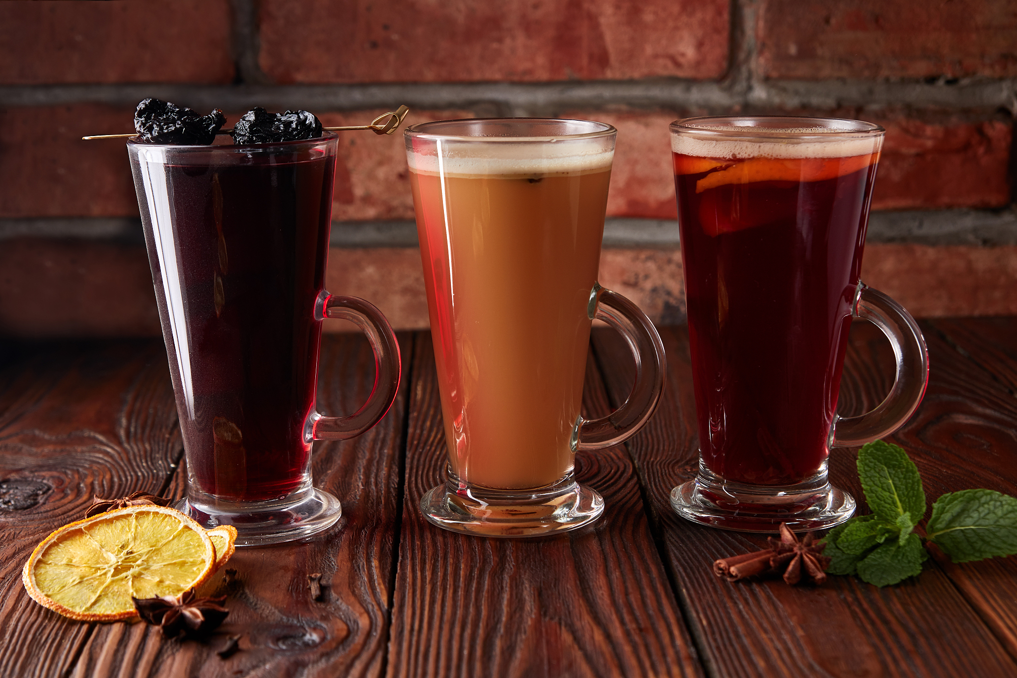 three glasses with hot alcoholic drinks