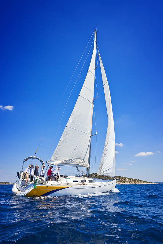 sailing crew on sailboat