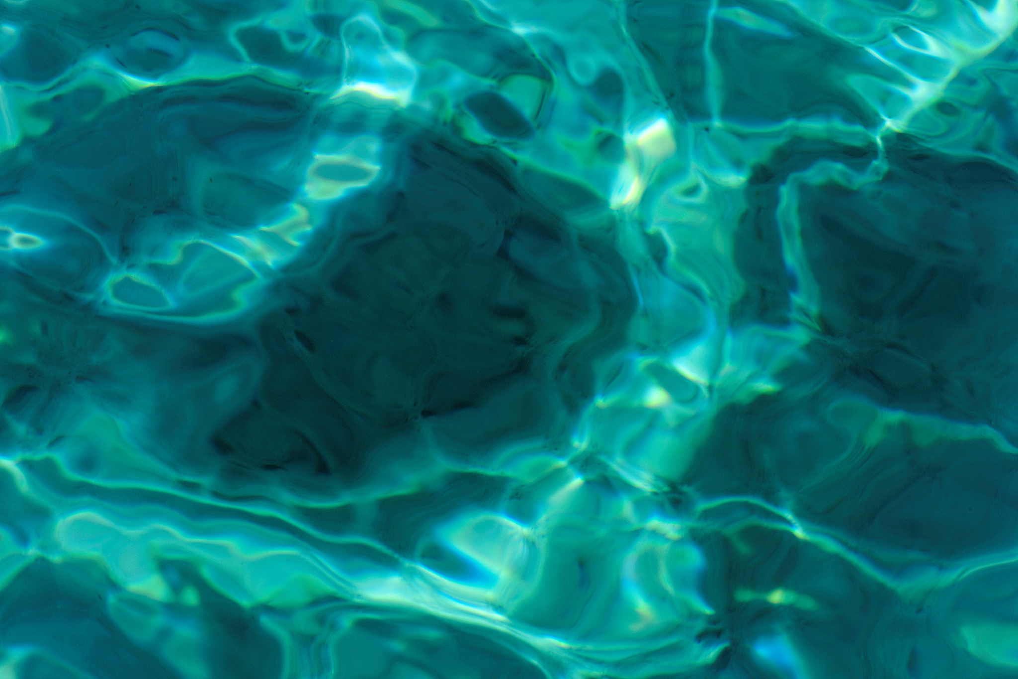 turquoise abstract background of wavy water surface