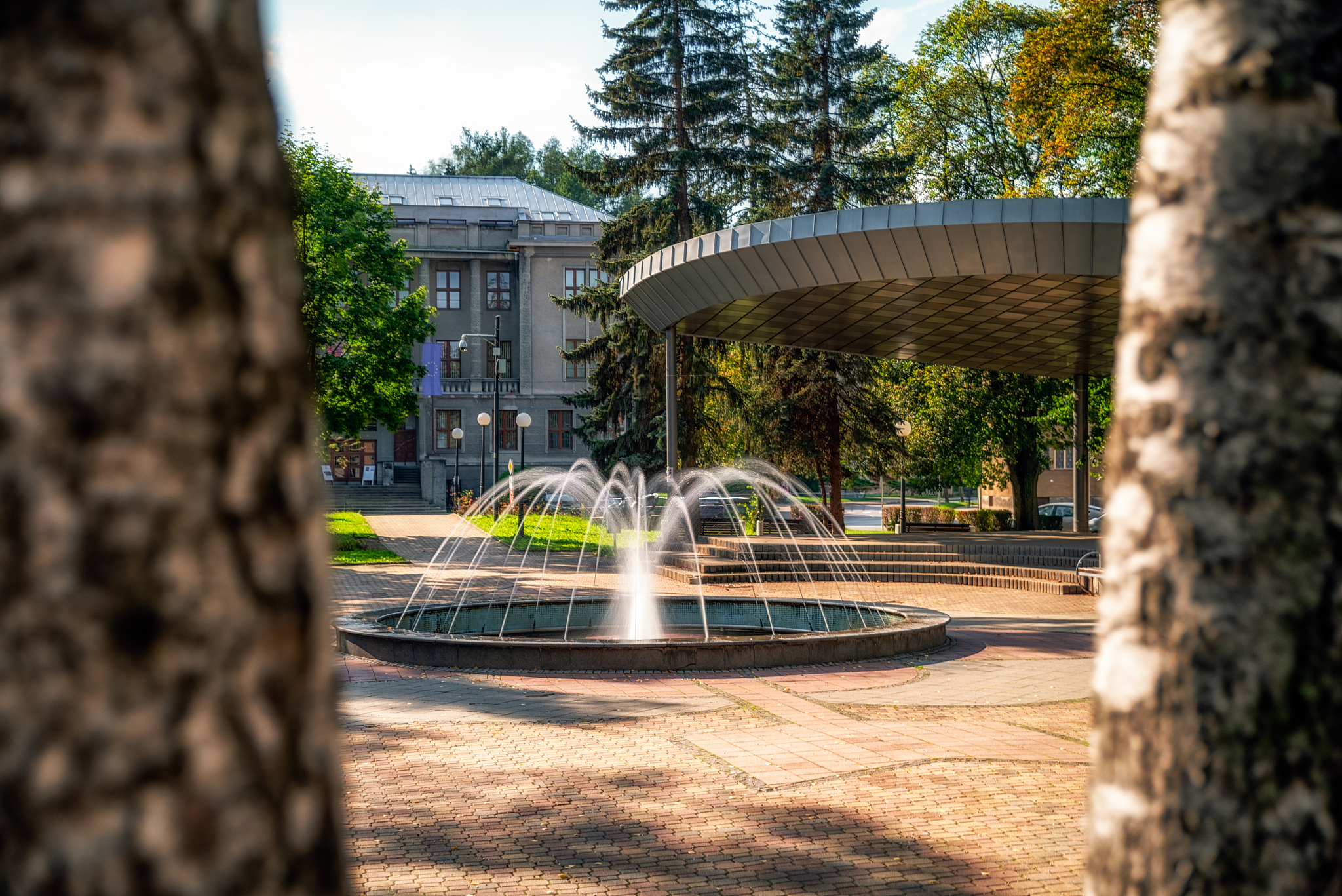 fountain in empty autumn park in town ruzomberok, slovakia