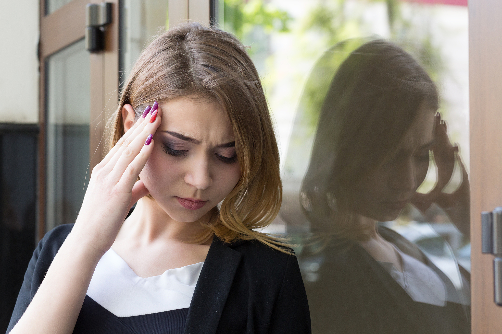 portrait stressed woman upset having headache