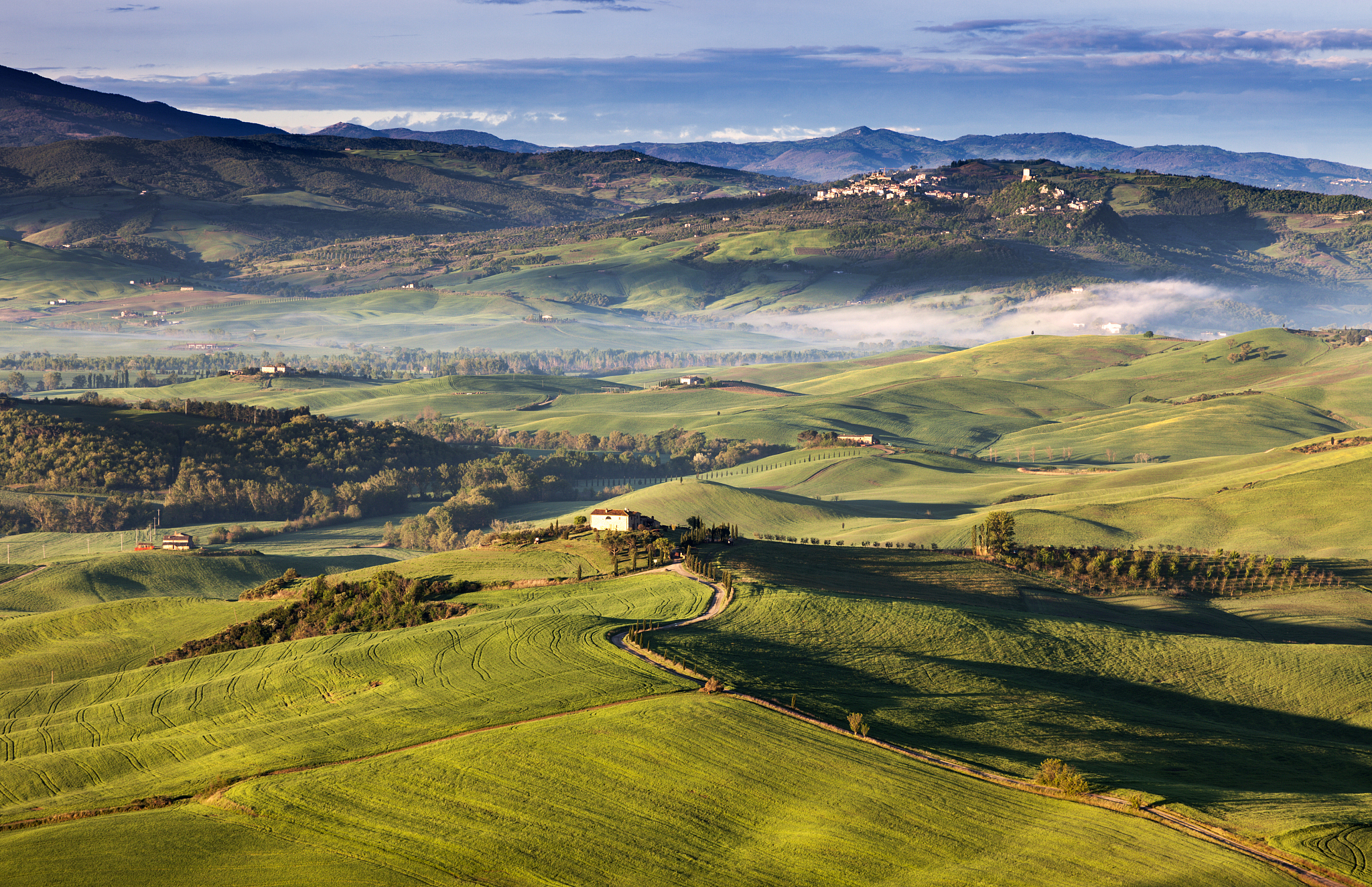 italy, tuscany, landscape with green hills and mountains