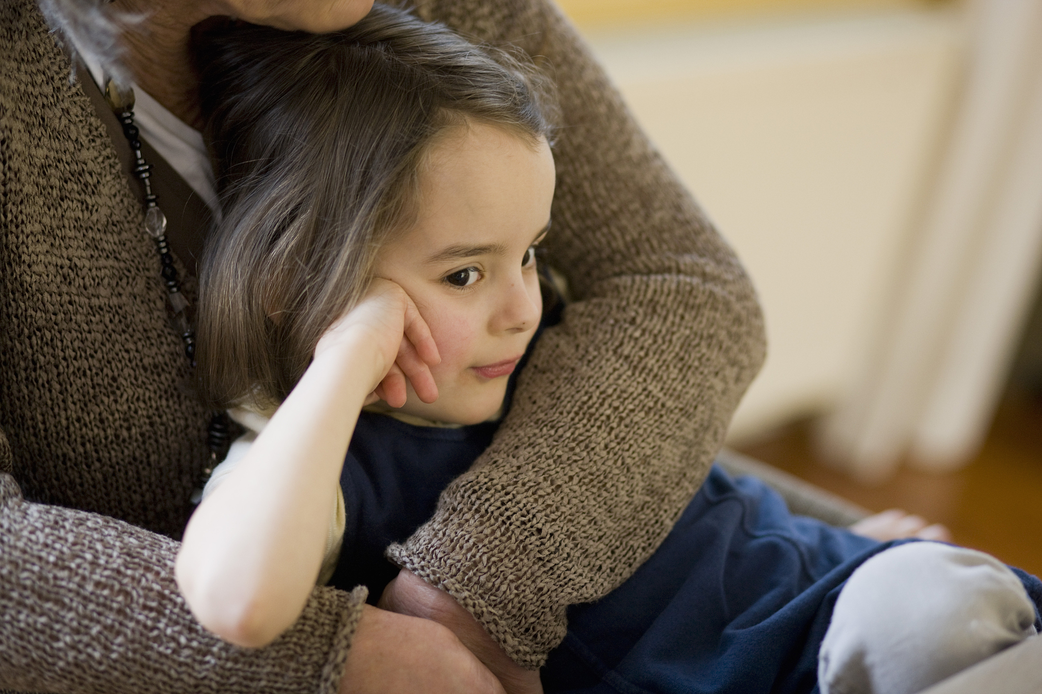 grandmother embracing grandchild